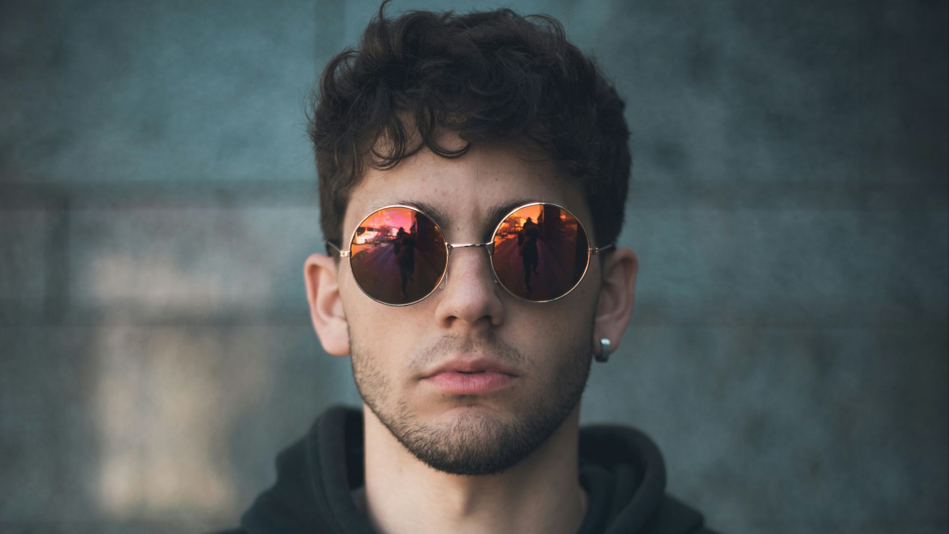 man standing wearing black Nike hoodie