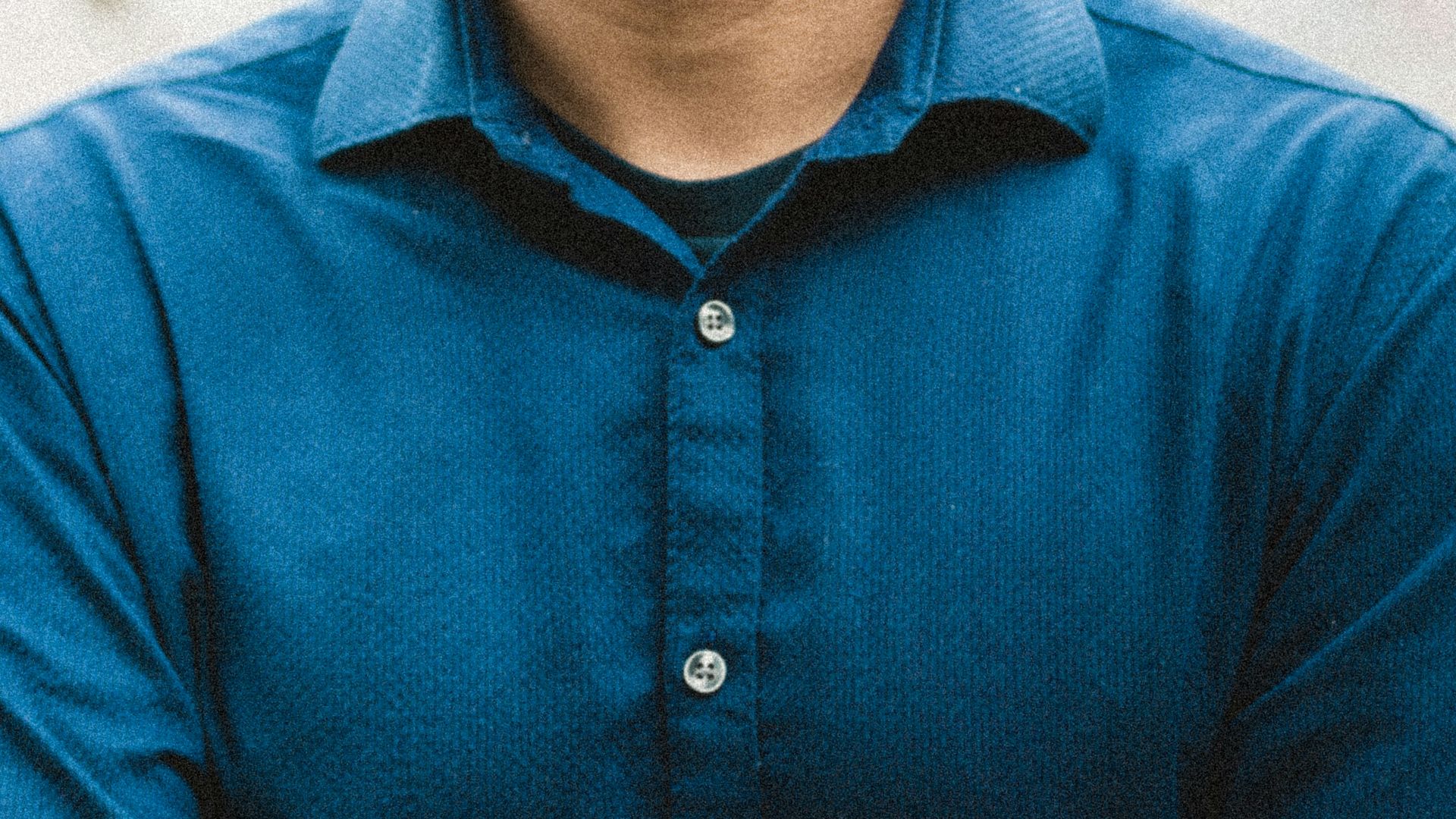man in blue button up shirt