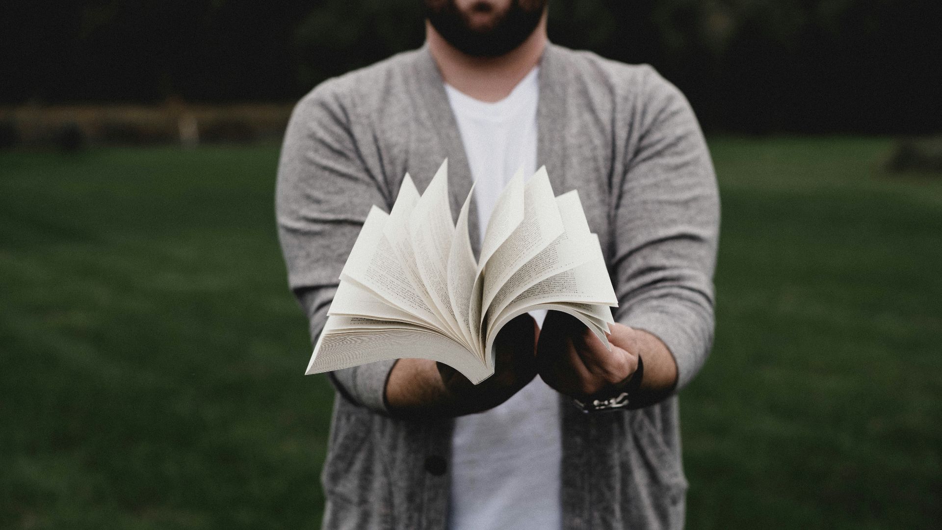 person opening book