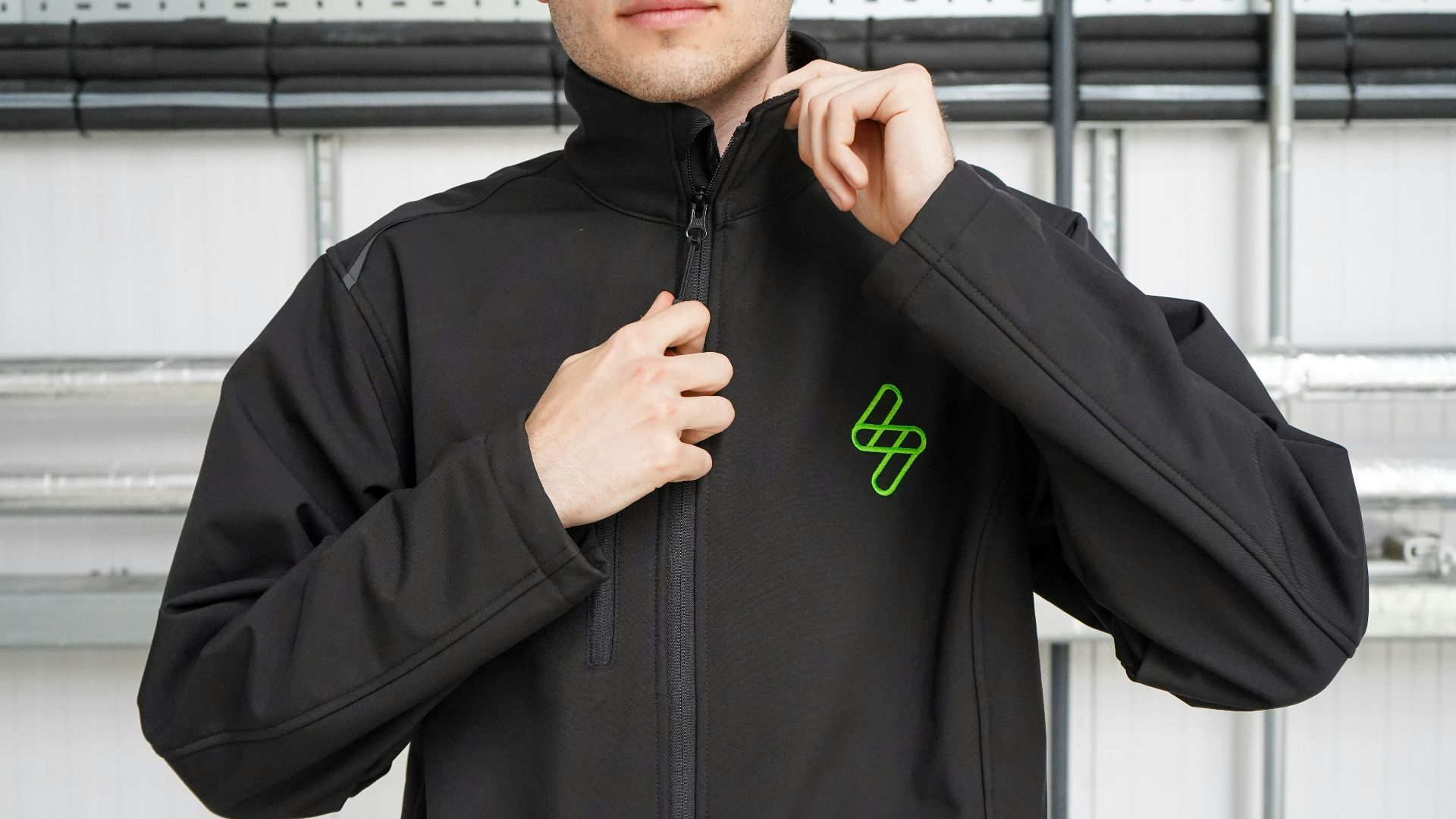 man in black nike hoodie standing near window