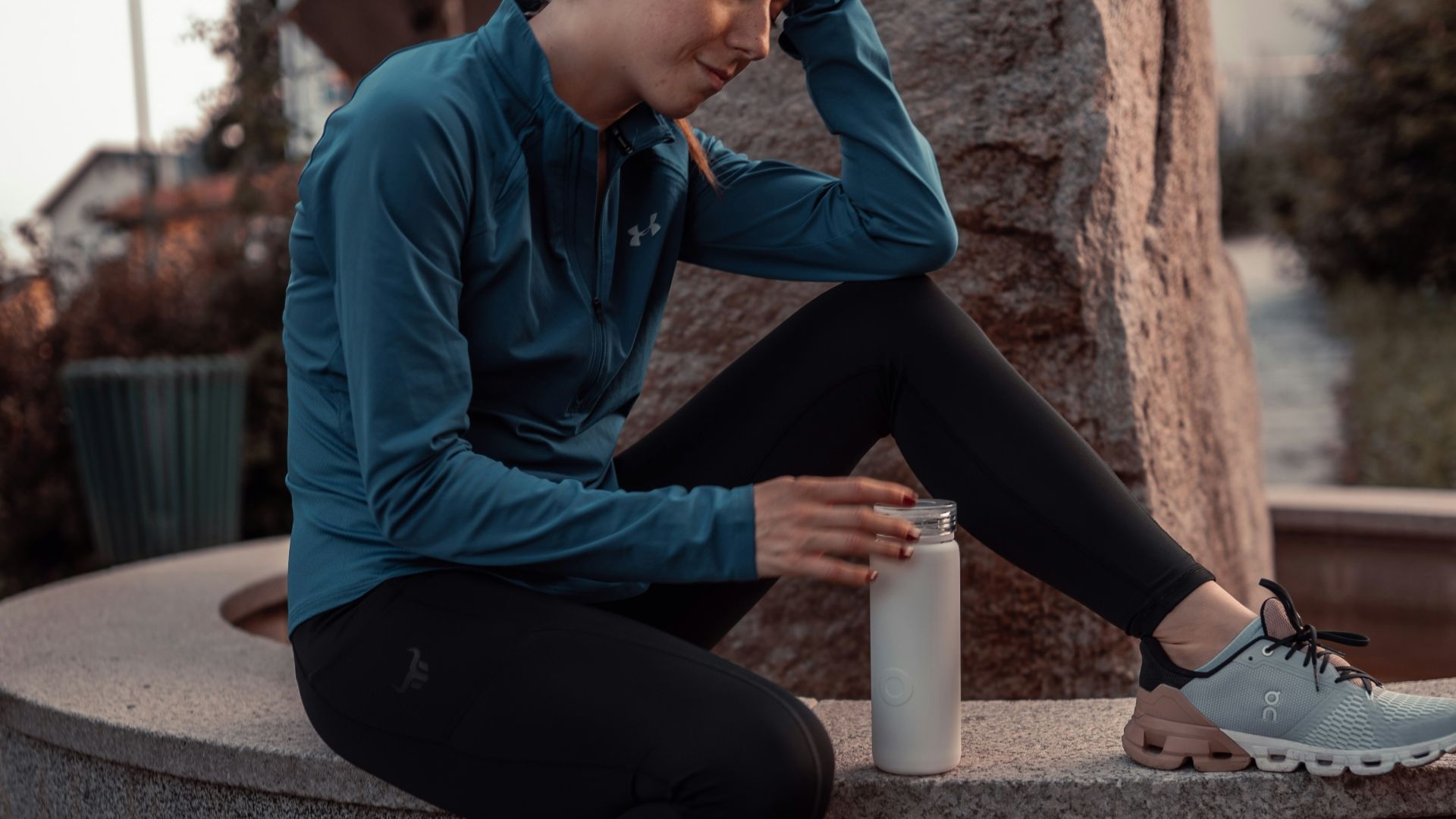 a man sitting on a ledge