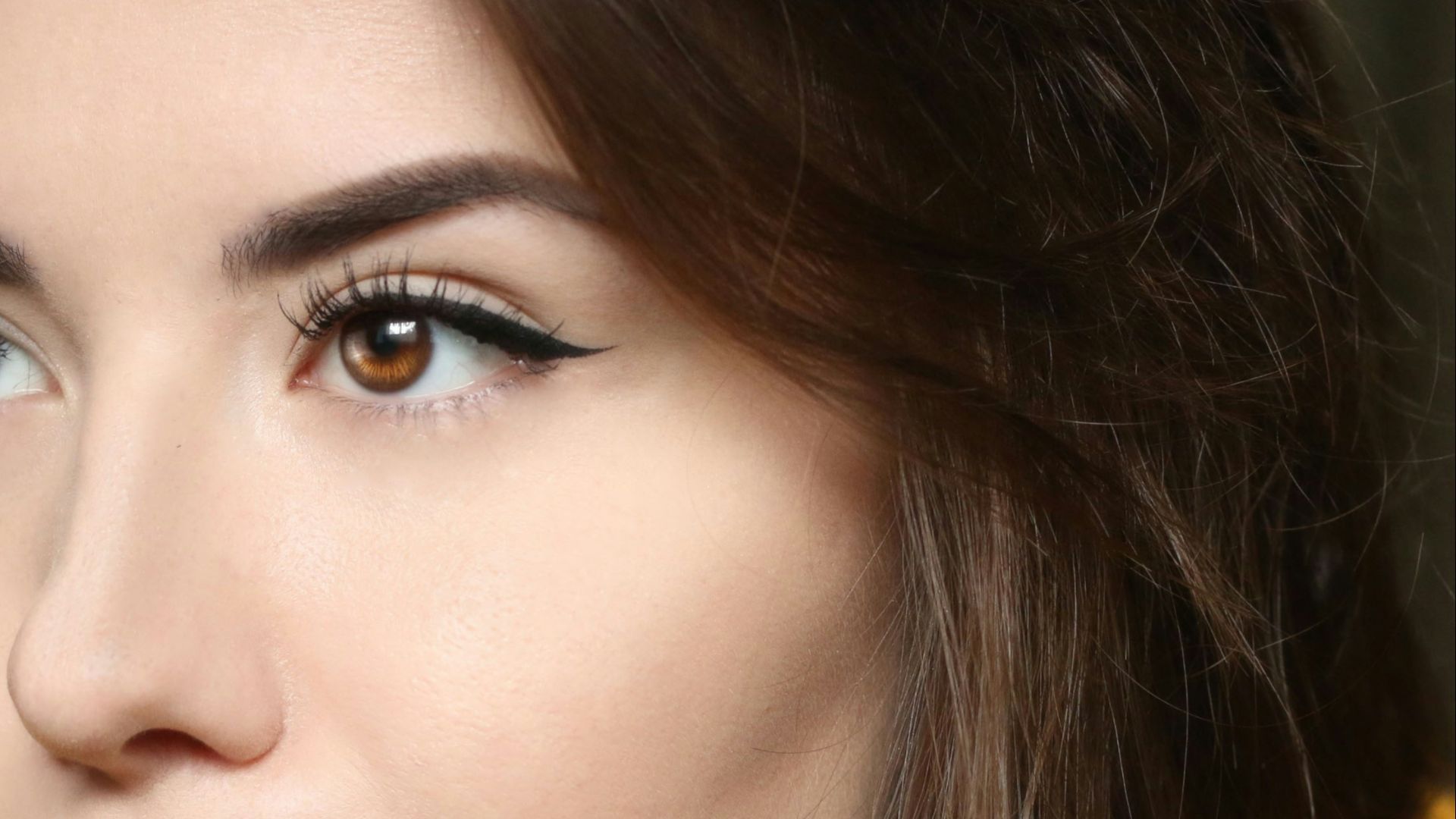 a close up of a person wearing a yellow shirt