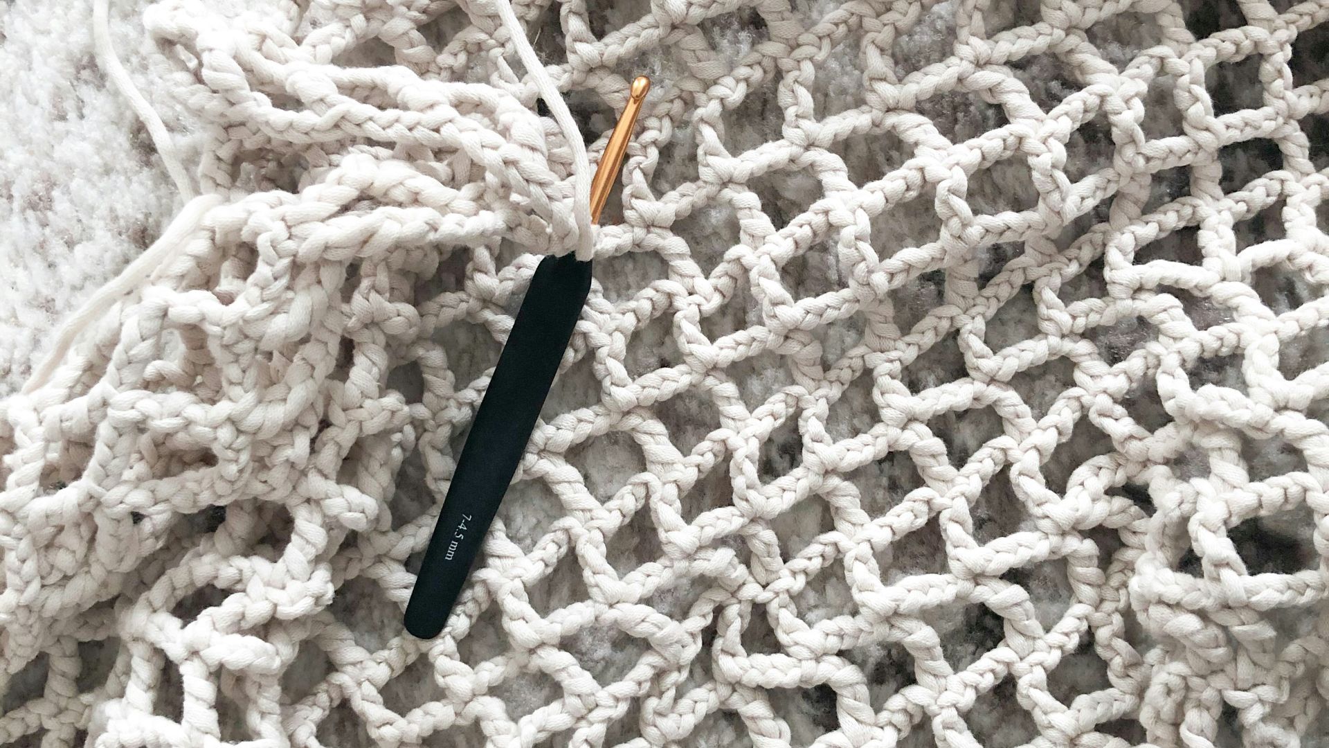 blue and yellow plastic tool on white textile