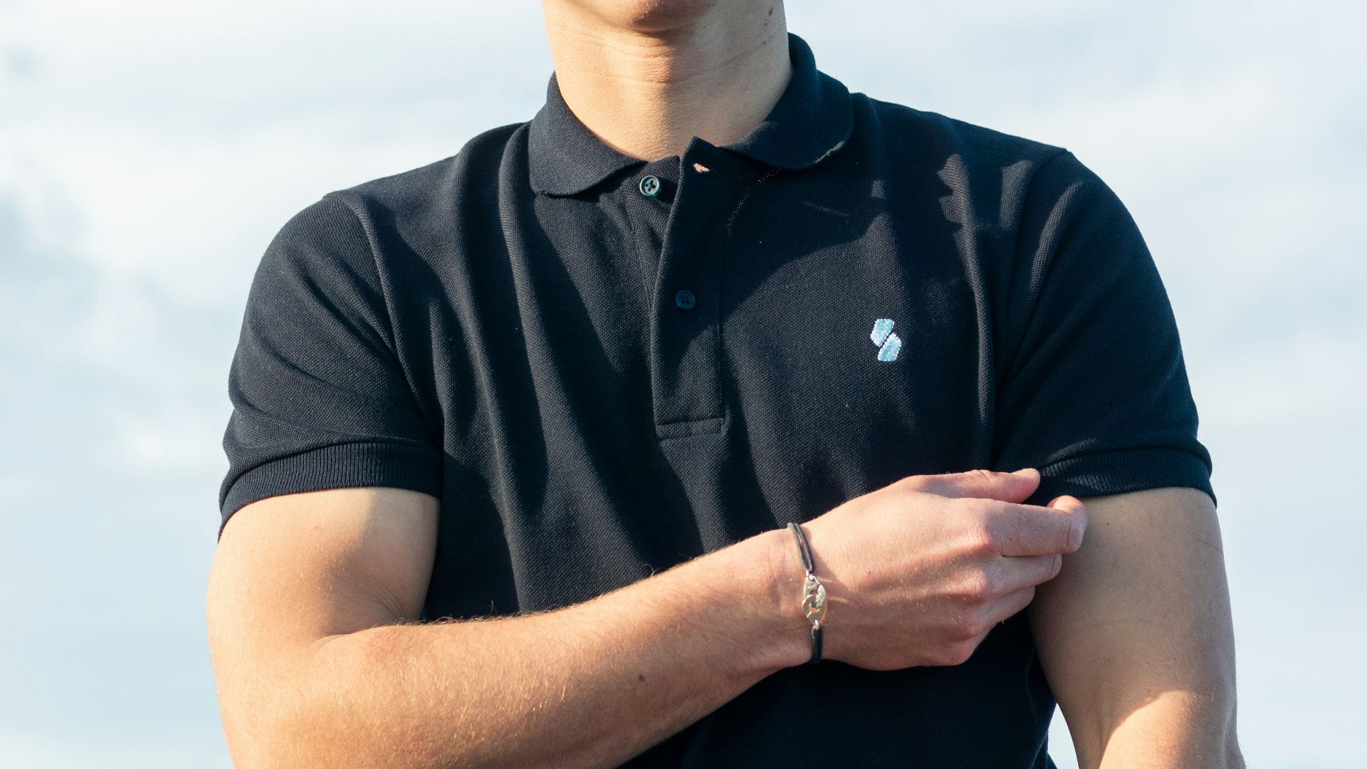 man in black polo shirt