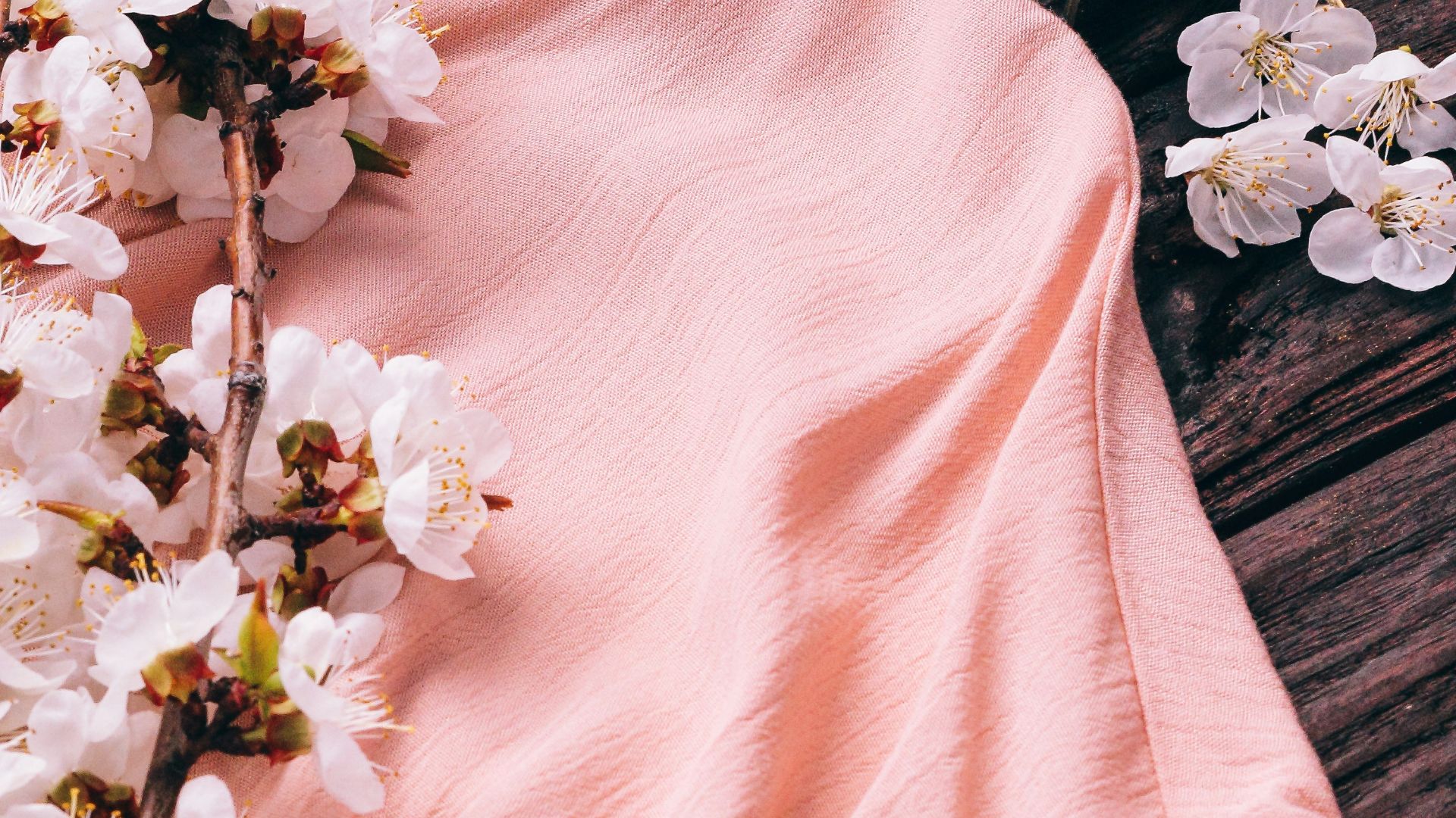 a pink shirt with flowers on it next to the eiffel tower