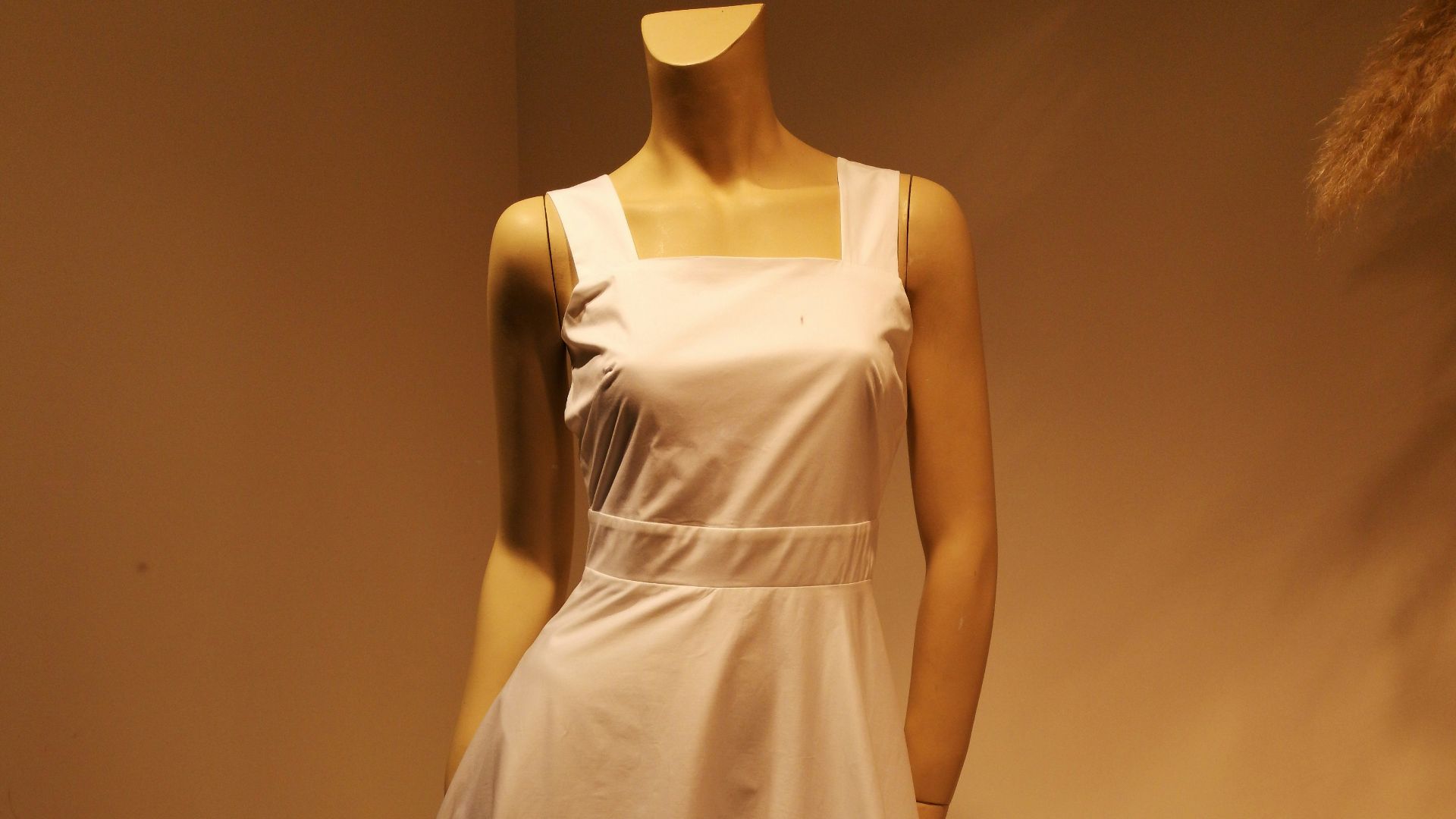woman in white sleeveless dress