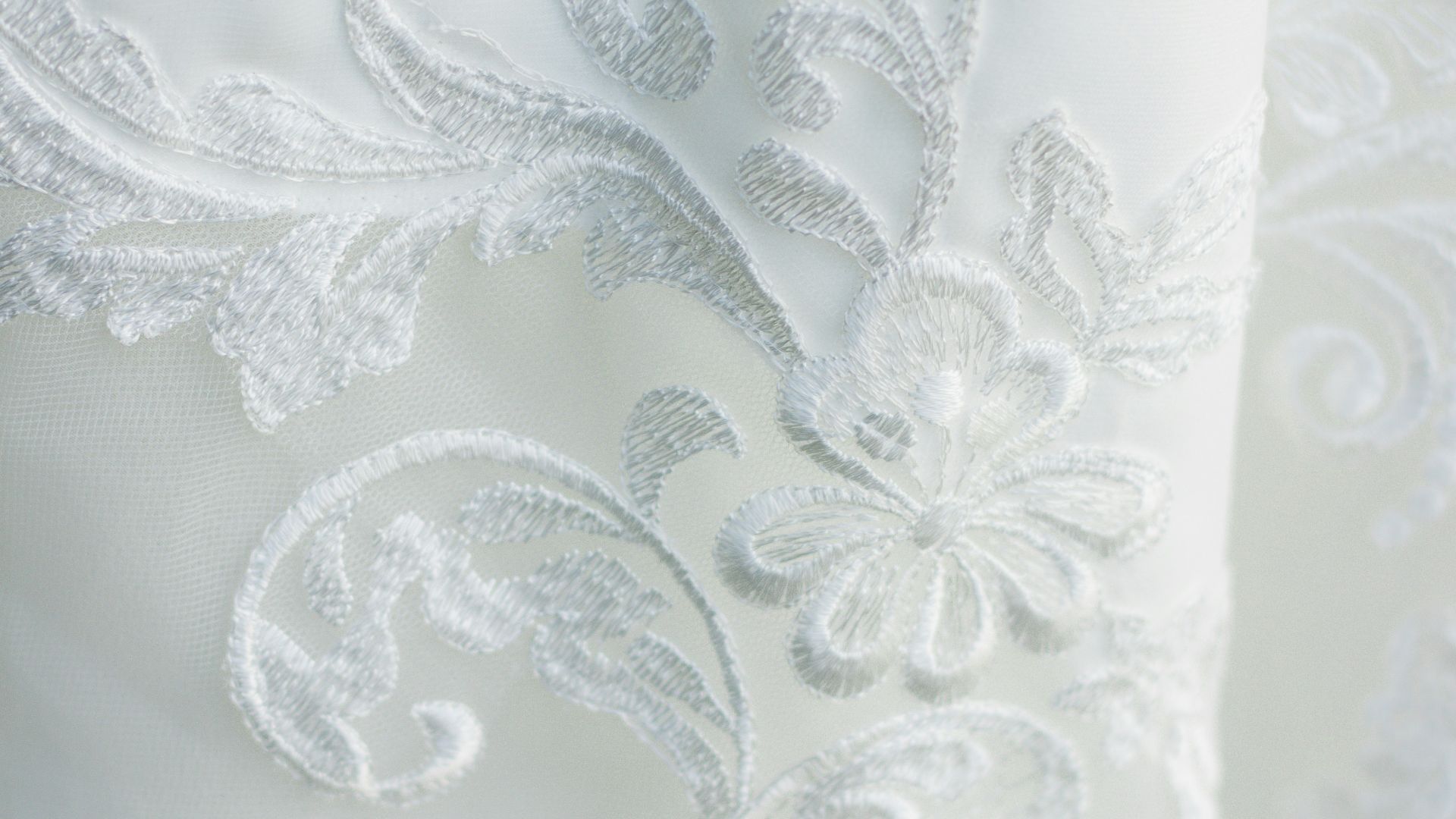 a close up of a white wedding dress