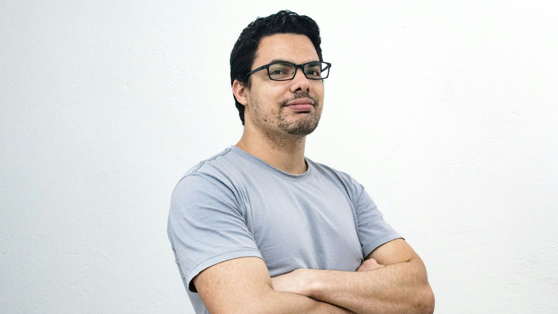 man crossing both arms