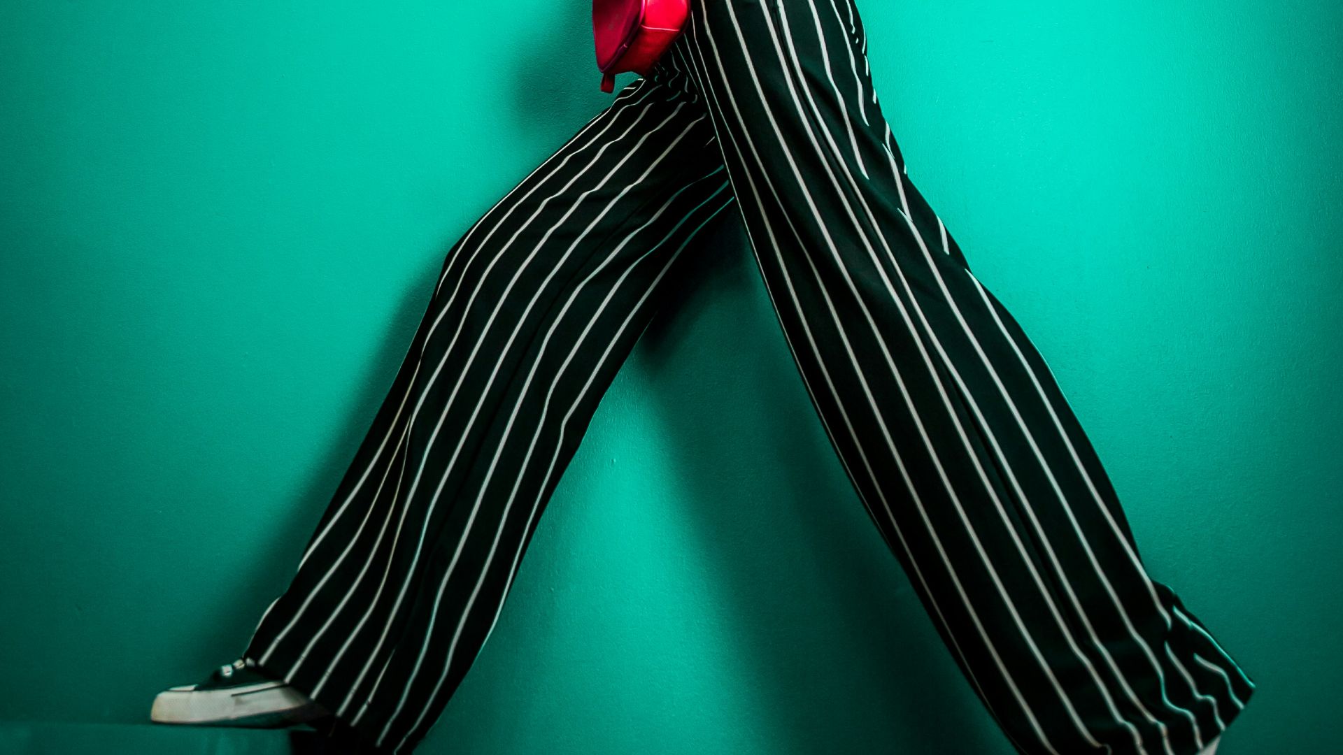 posing woman in white sleeveless top