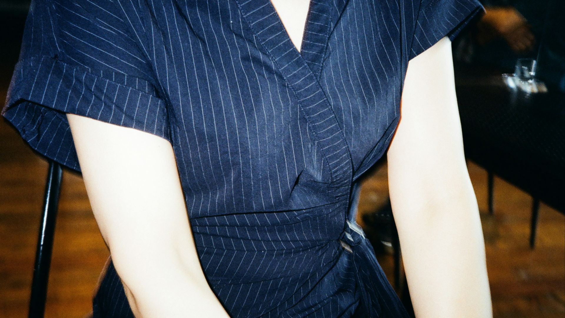 person in blue and white stripe button up shirt