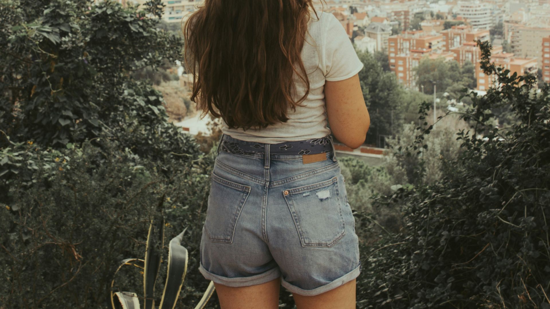 women's white top and blue denim shorts