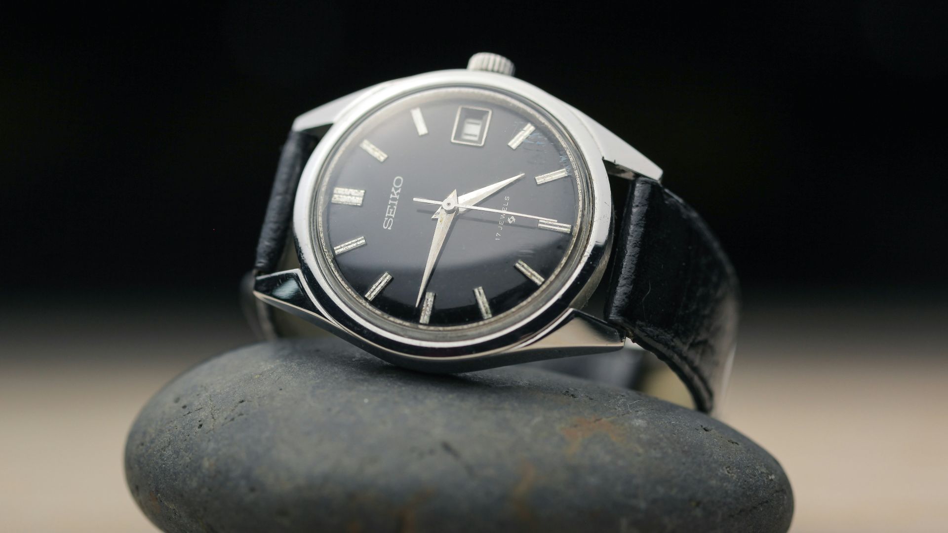 black round analog watch at 10 10