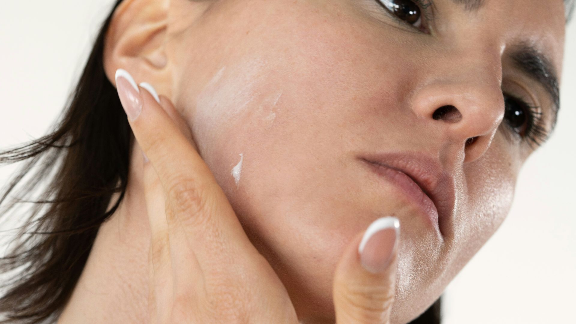a woman with a lot of cream on her face