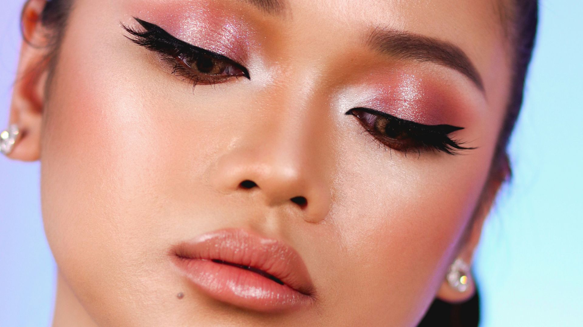 woman with pink lipstick and white shirt