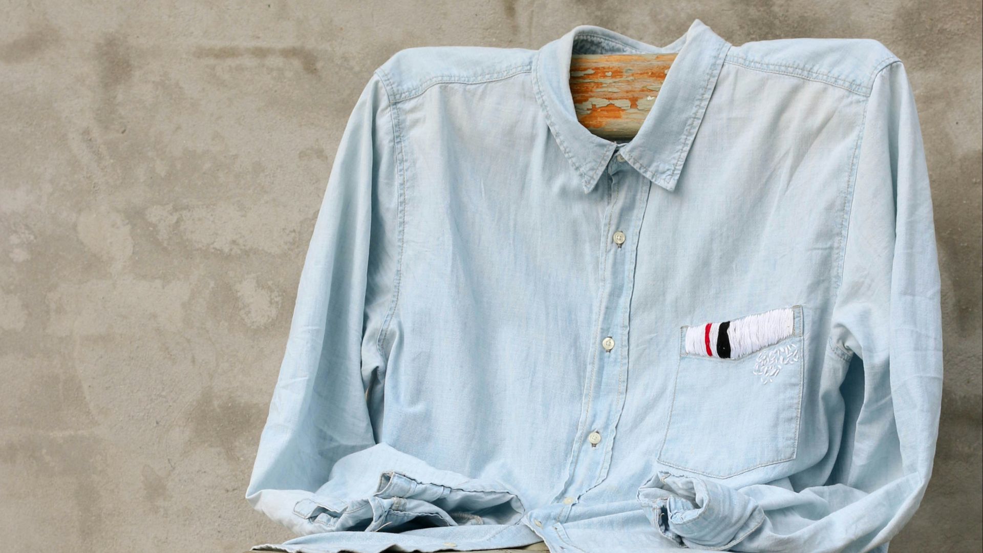 blue dress shirt on chair