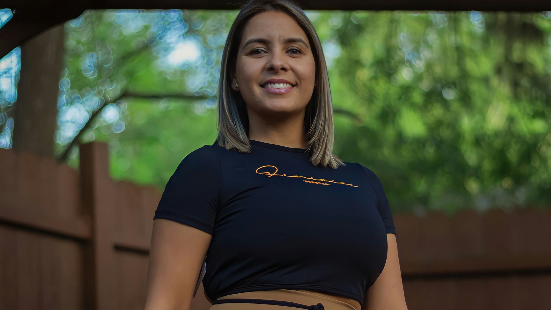 a woman in tight pants posing for a picture