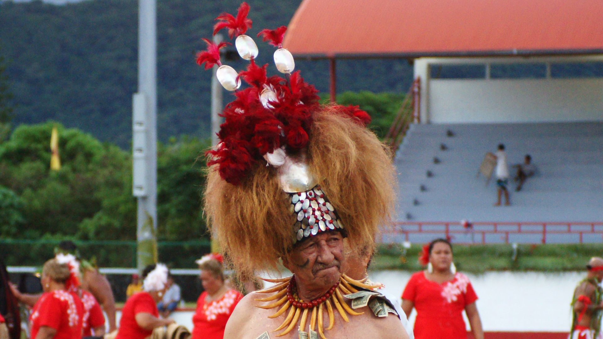 File:Paramount Chief performs while in full traditional attire. The headpiece is called the
