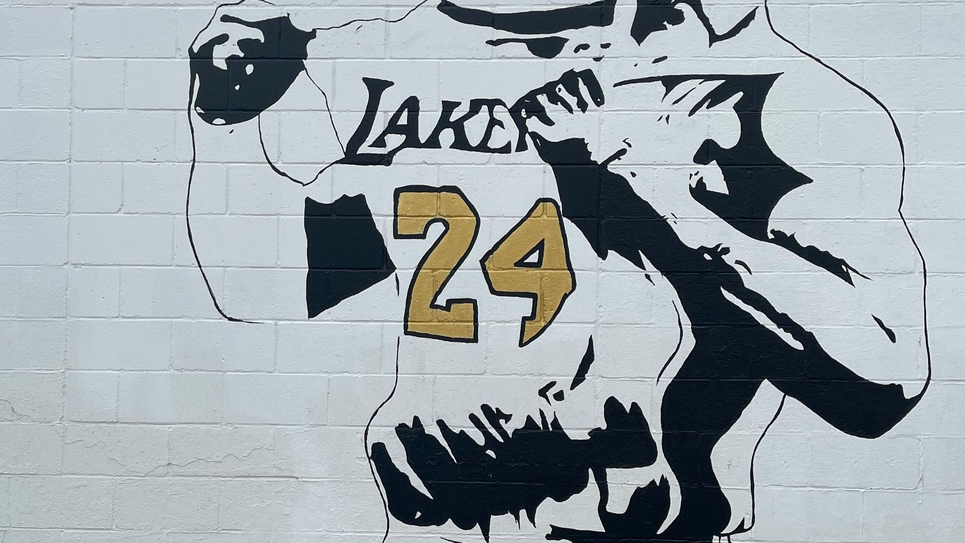 a mural of a man holding a baseball bat