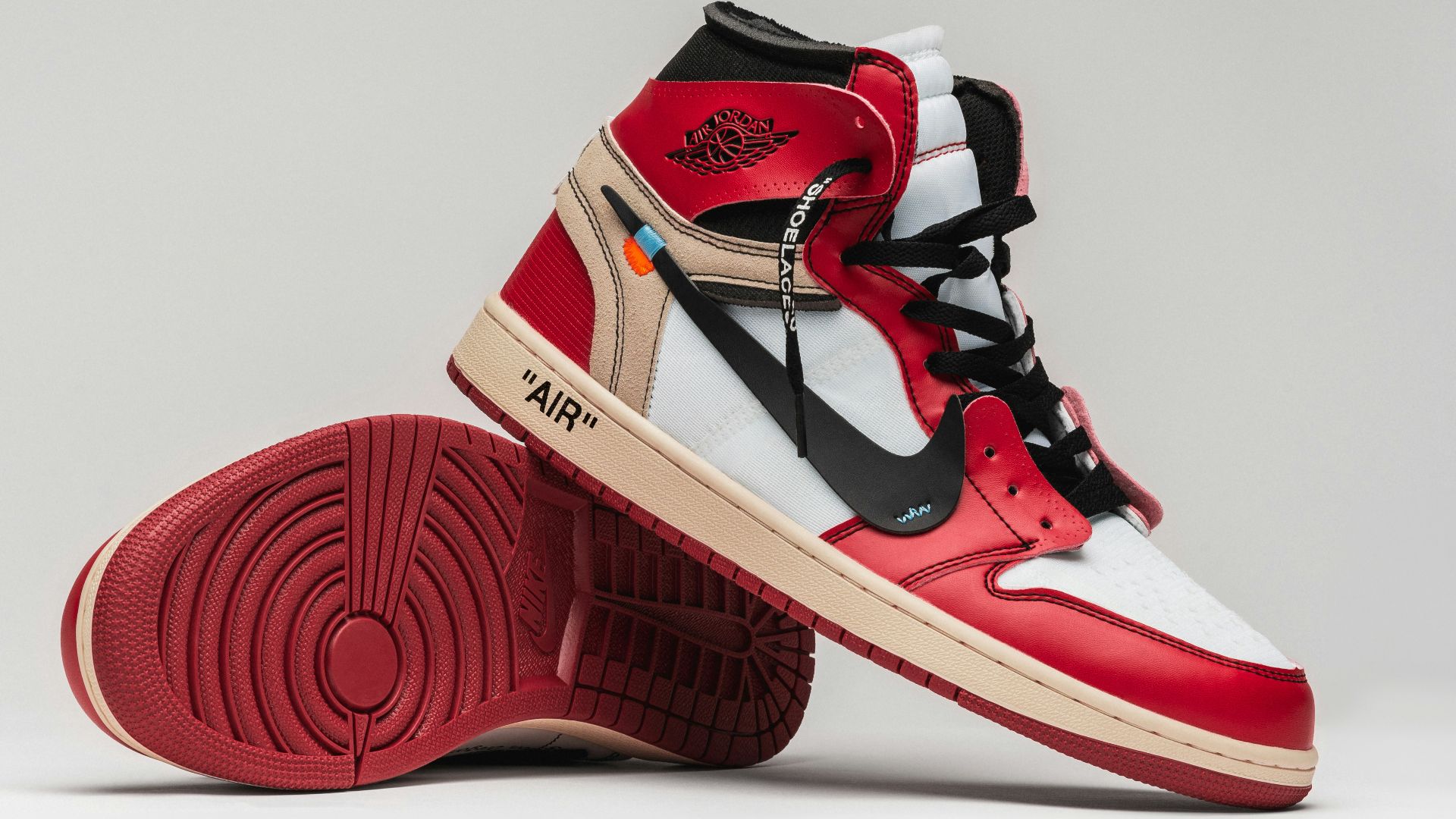 a pair of red, white and black sneakers