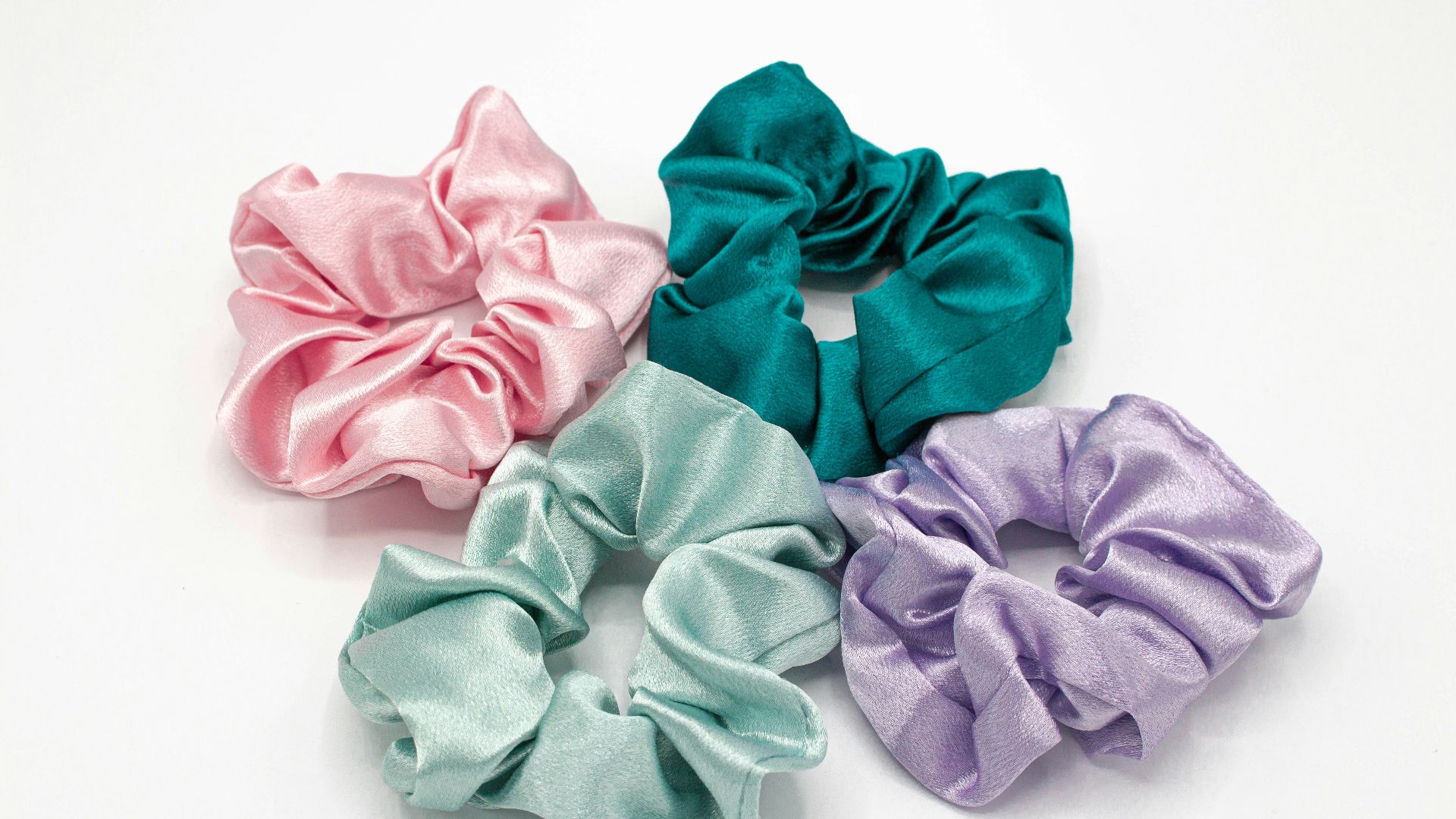 pink and teal textile on white surface
