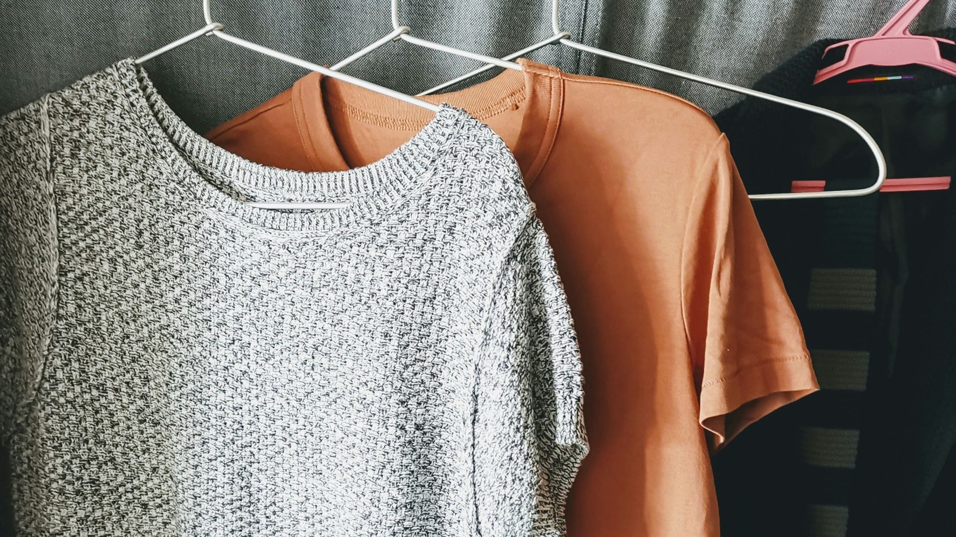 three assorted-color shirts