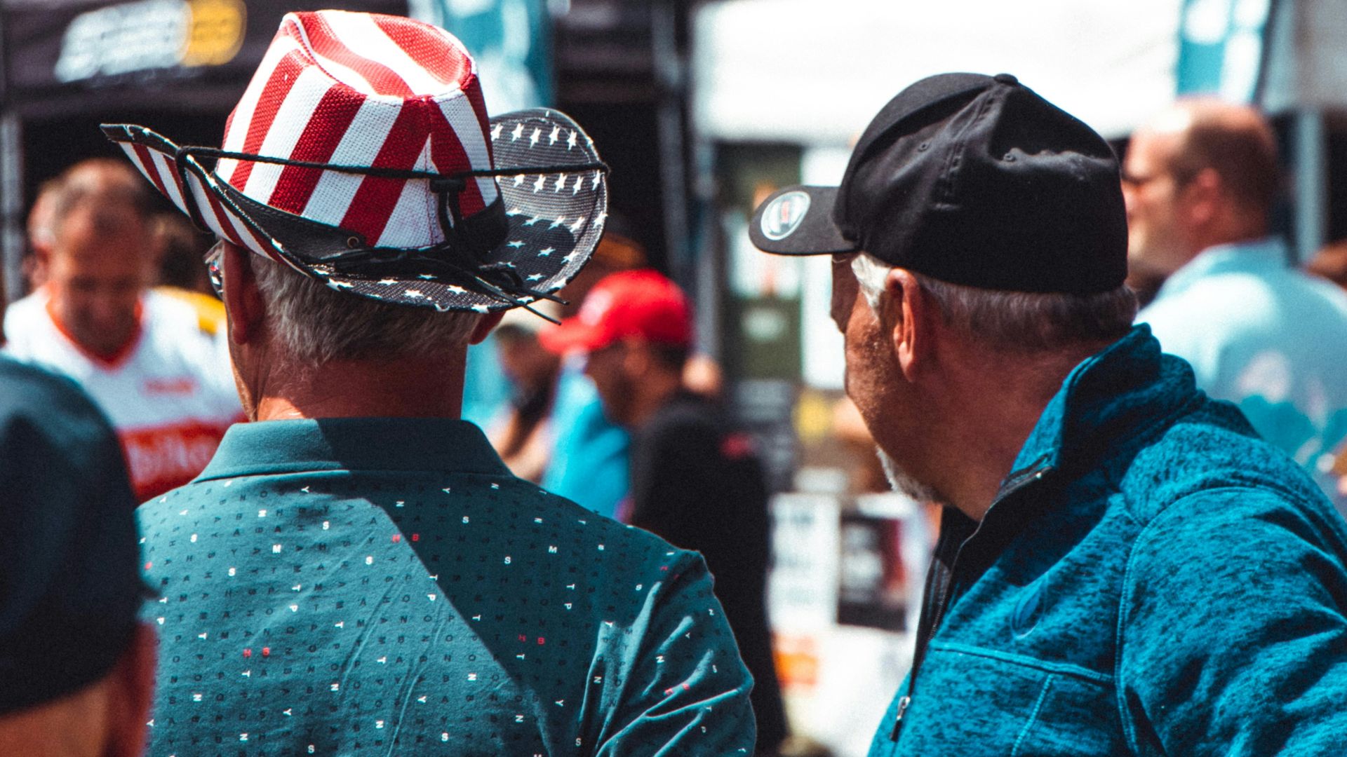 man in blue jacket wearing black cap