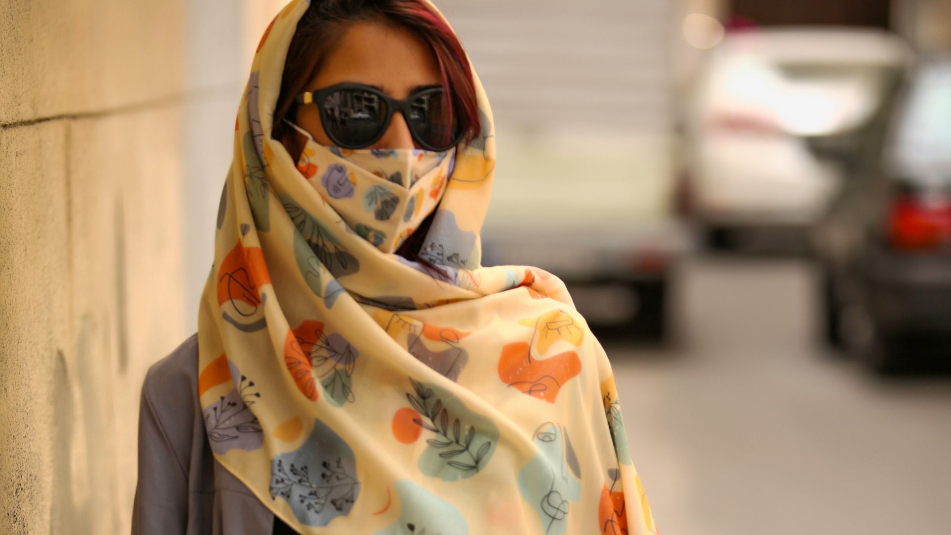 woman in yellow and white floral hijab