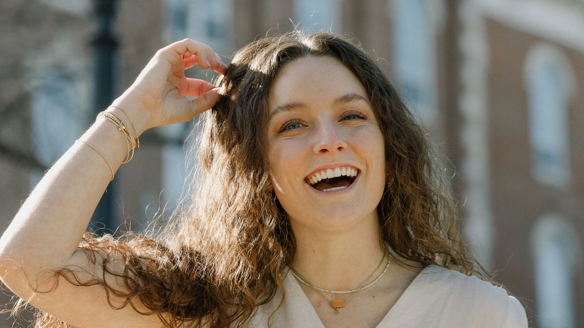 a woman standing in front of a building