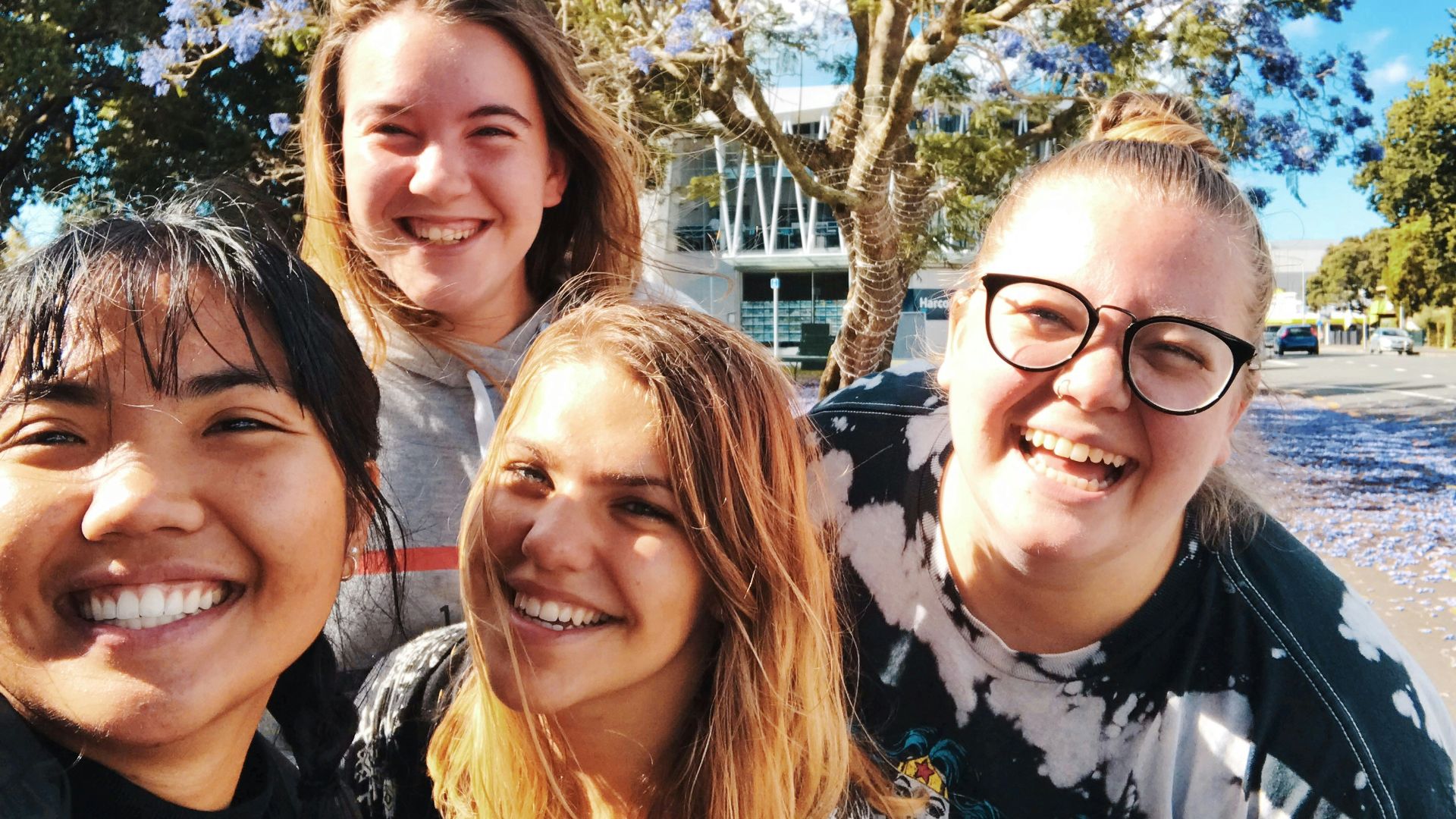four girl smiling outdoor