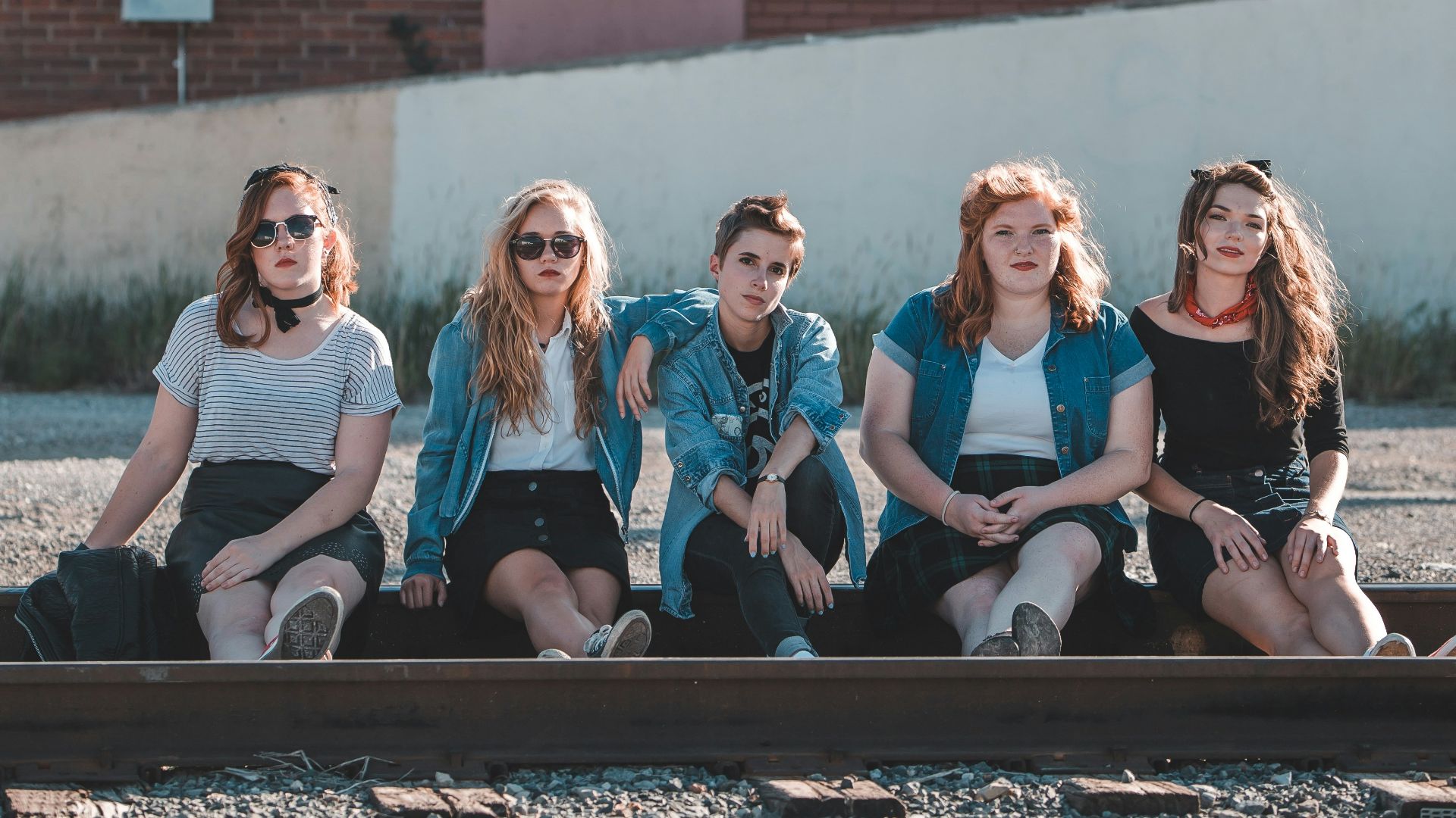 people sitting on train railway
