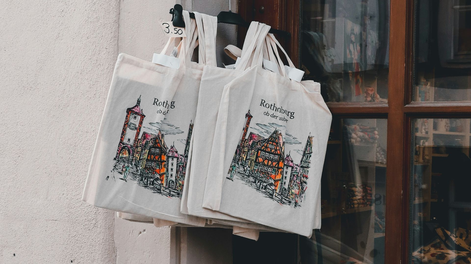 a couple of bags hanging from the side of a building