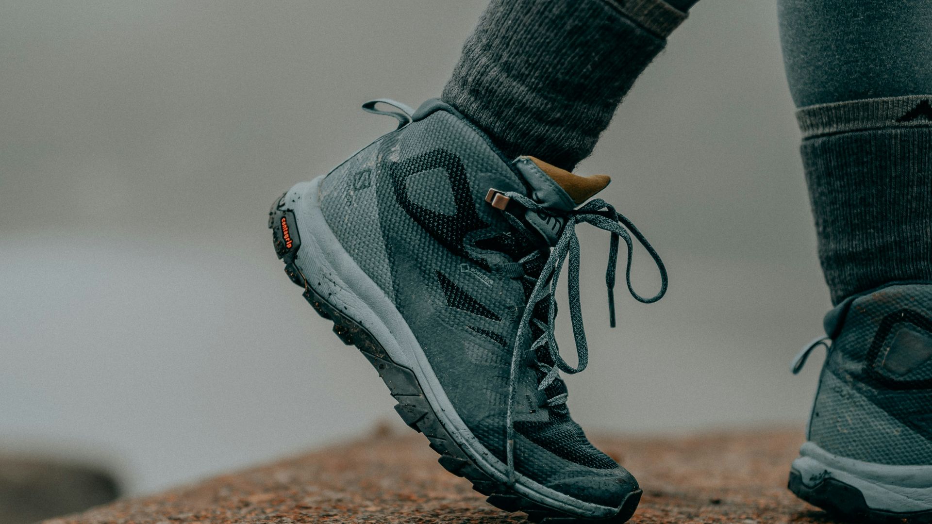 person in gray nike running shoes