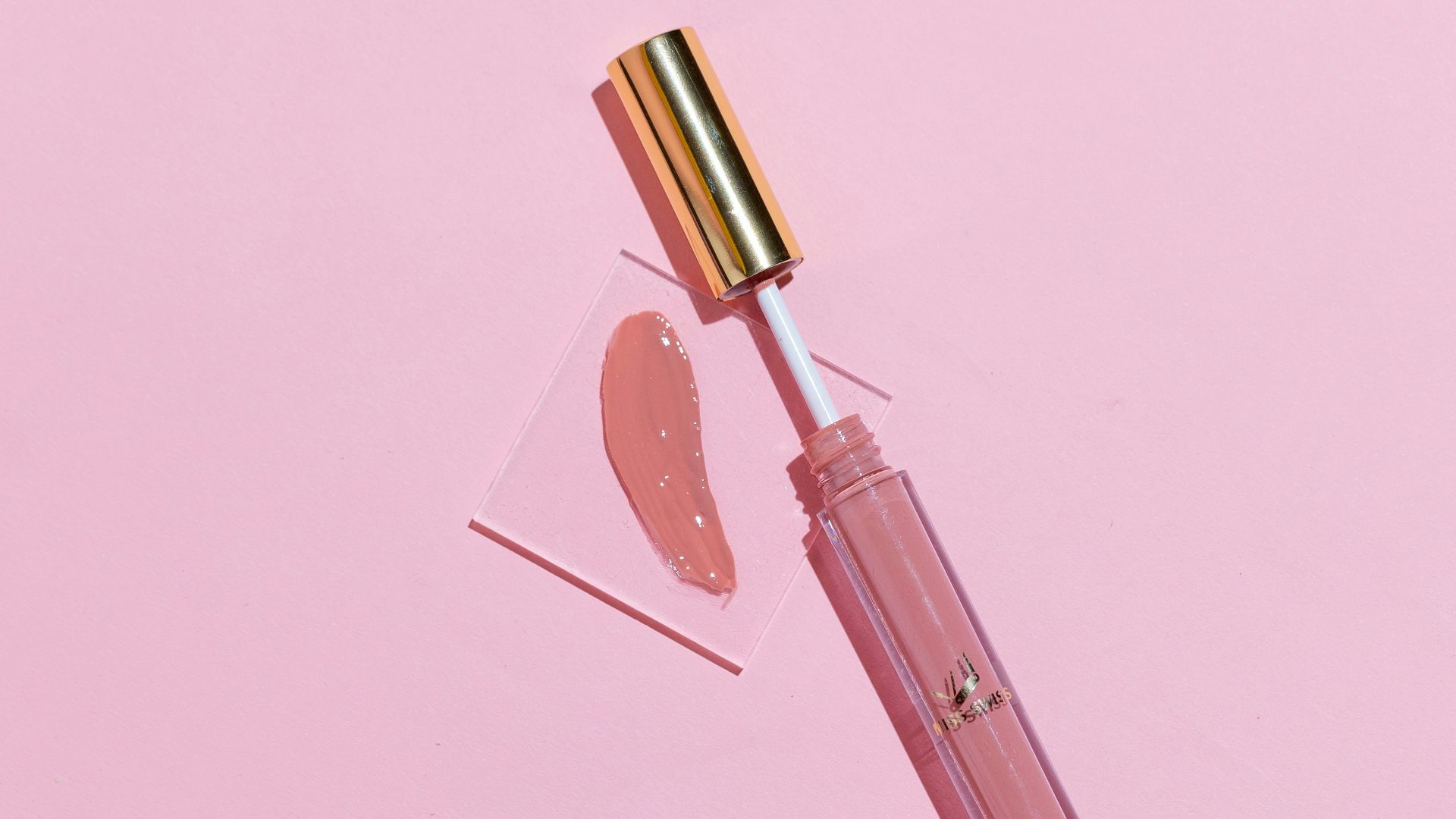 pink lipstick on pink surface