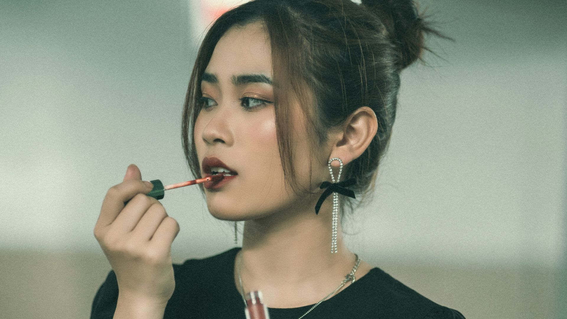 a woman with a cigarette in her mouth