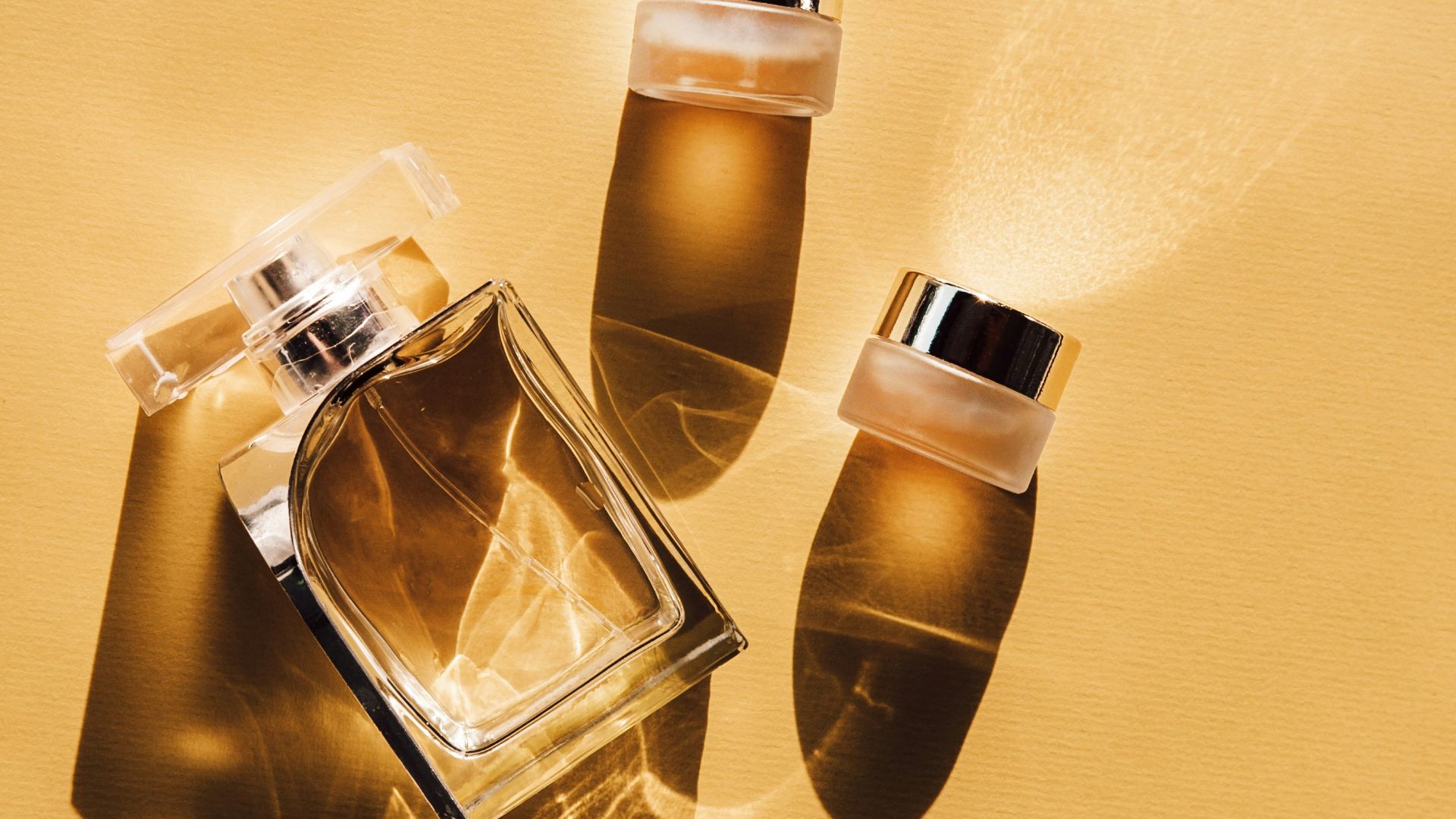 two clear glass perfume bottles