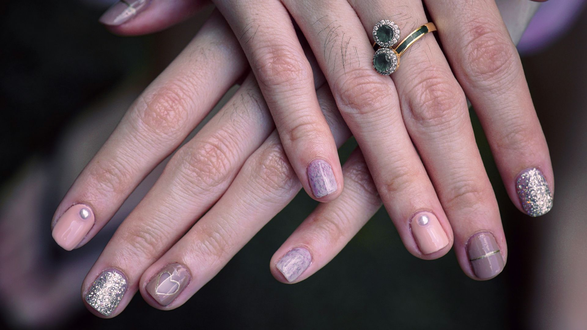 woman with manicure and ring