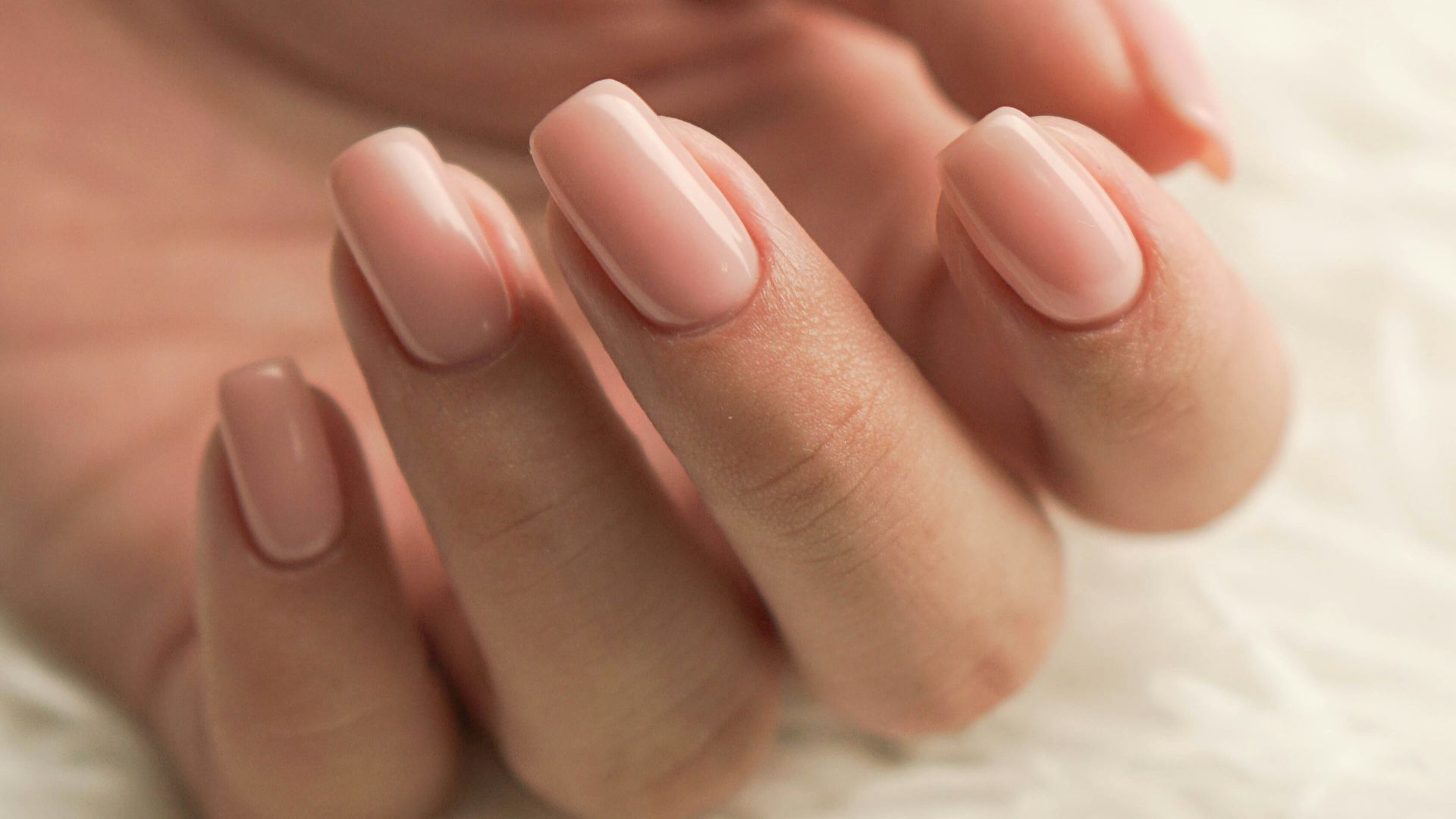persons feet on white textile