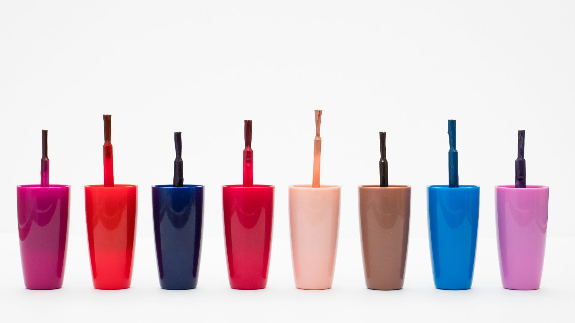 eight assorted color glass bottles