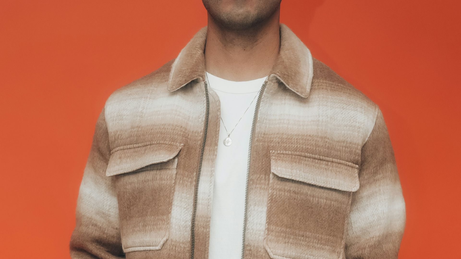 man in white dress shirt and gray vest