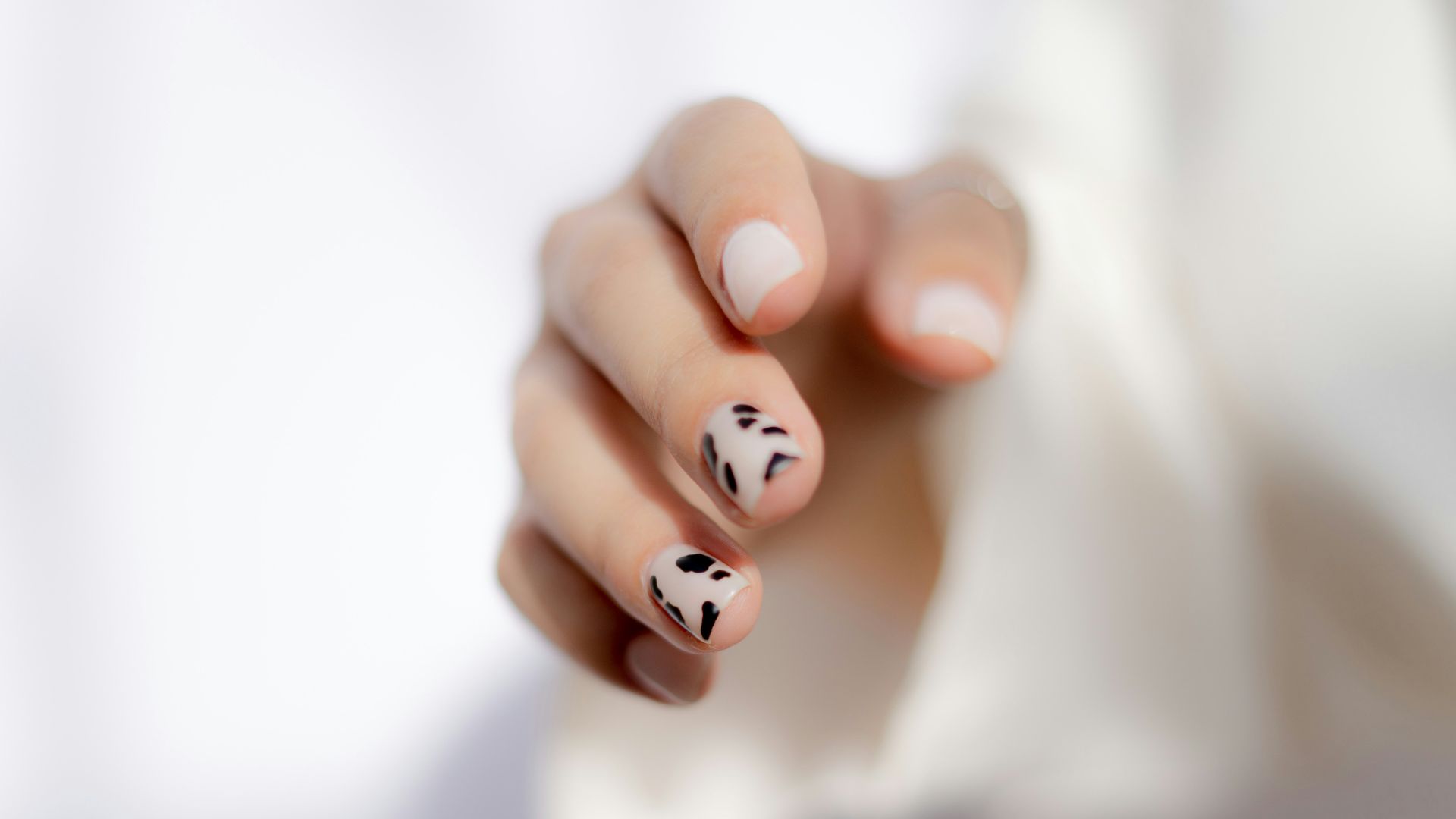 a hand with painted nails