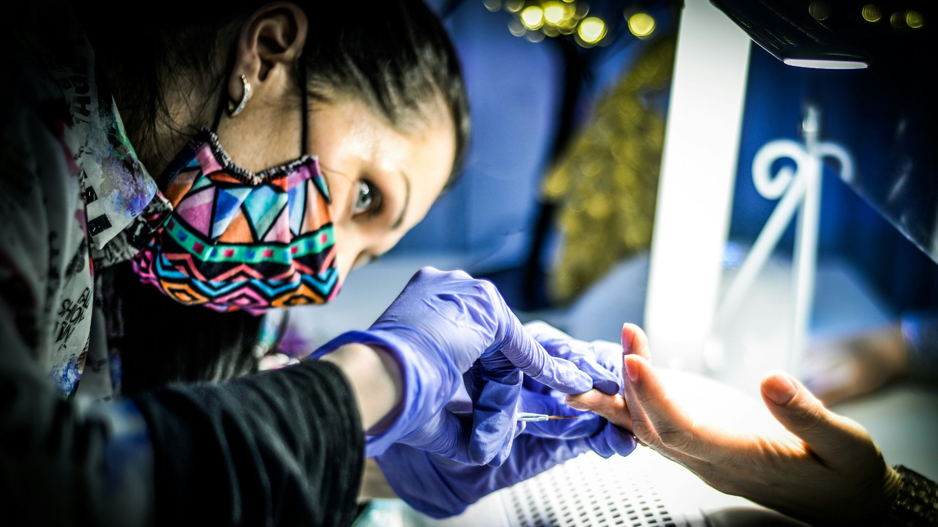 a woman wearing a face mask and gloves