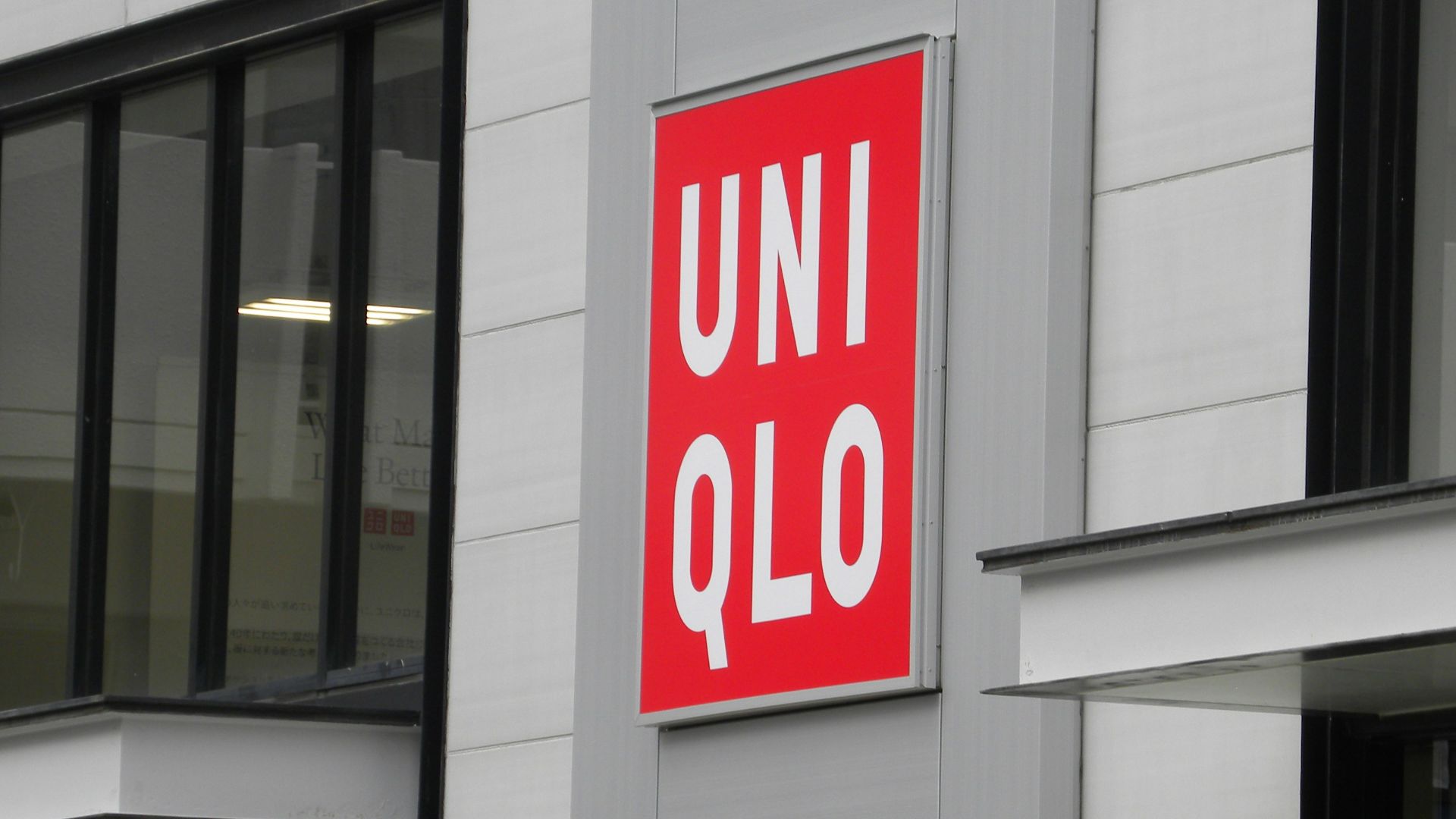 A building with a red sign on the side of it