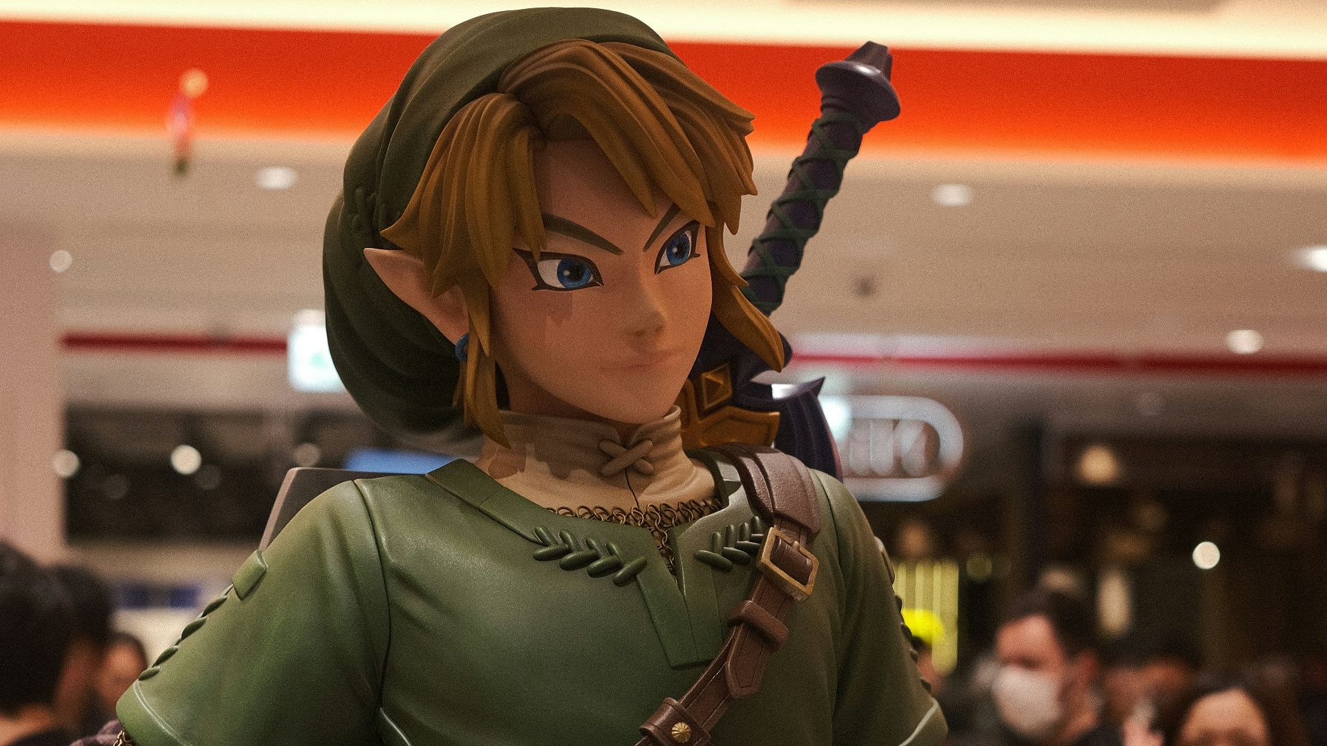 a statue of a woman in a green outfit