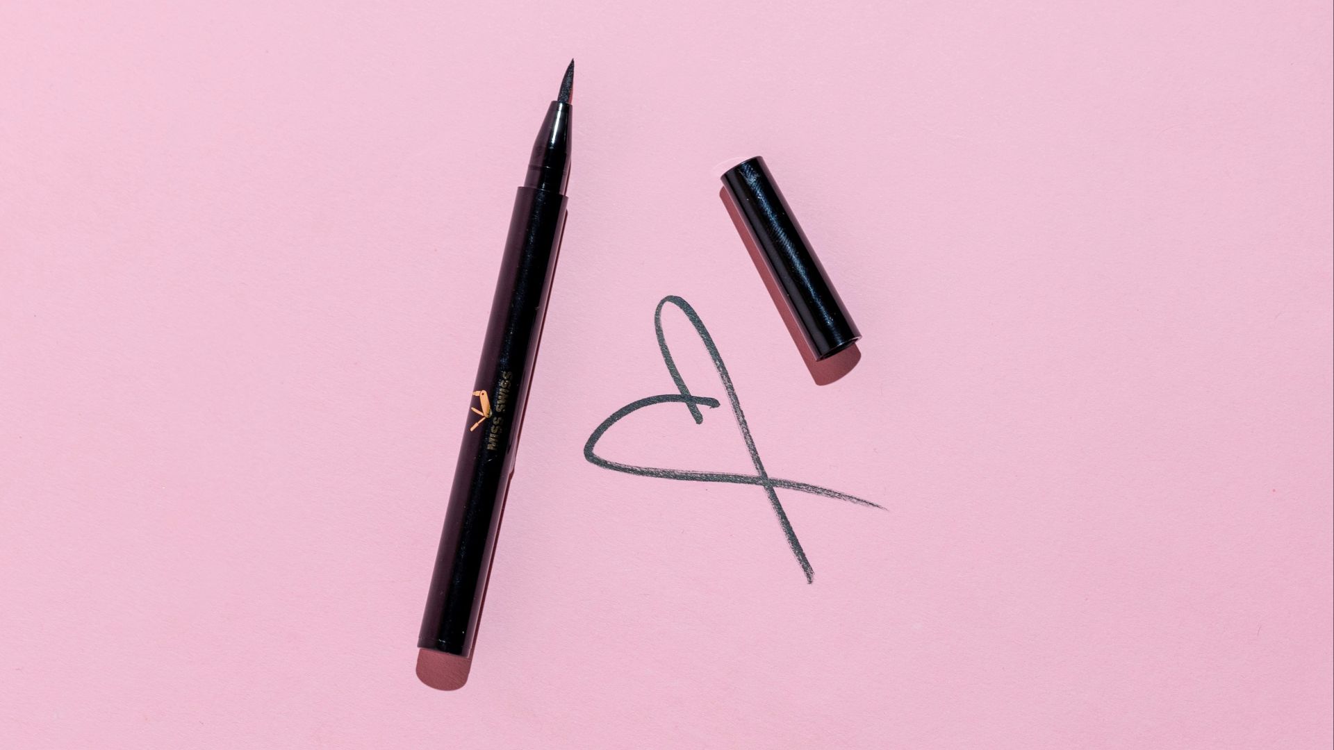 black pen and black framed eyeglasses