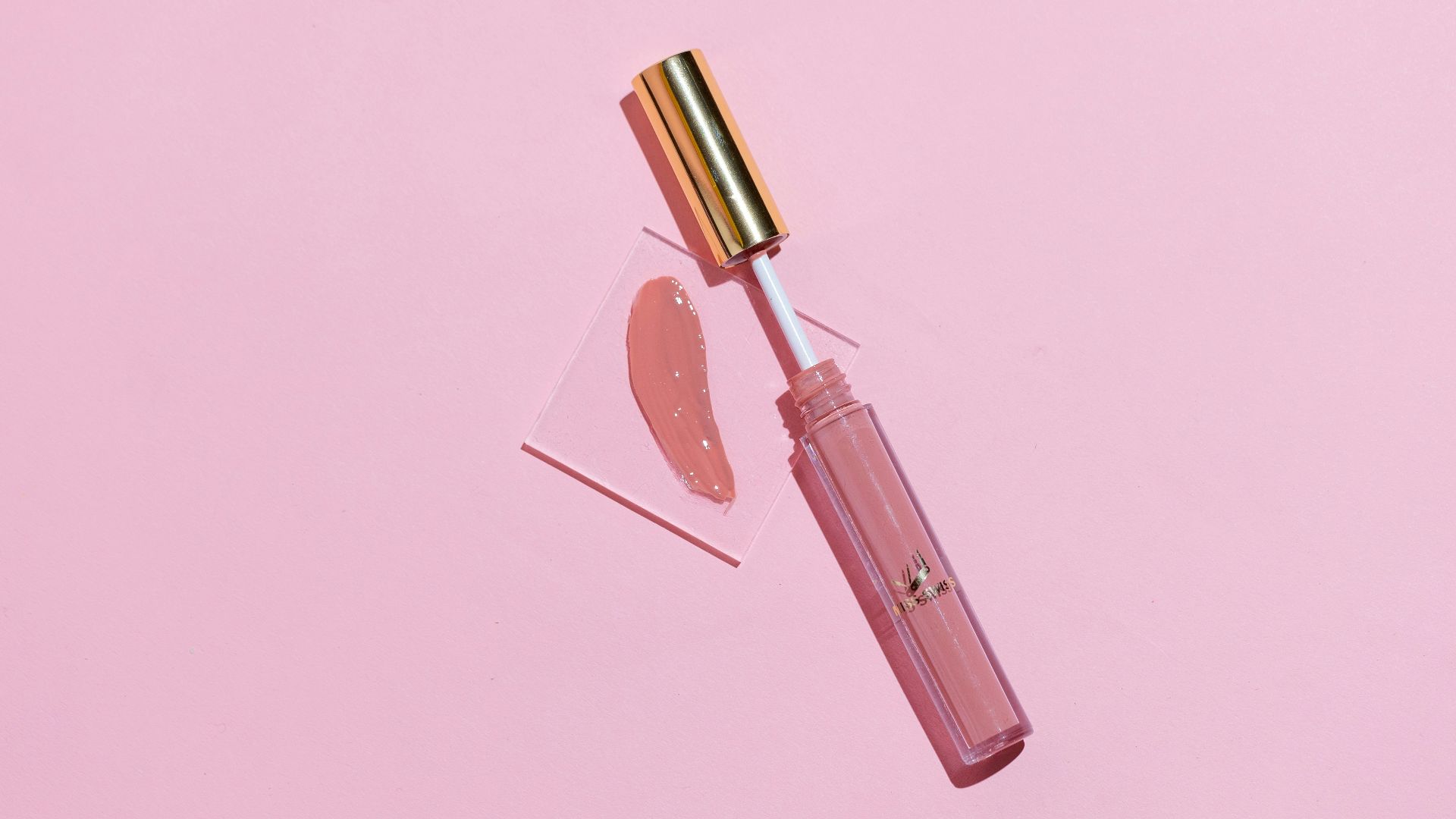 pink lipstick on pink surface