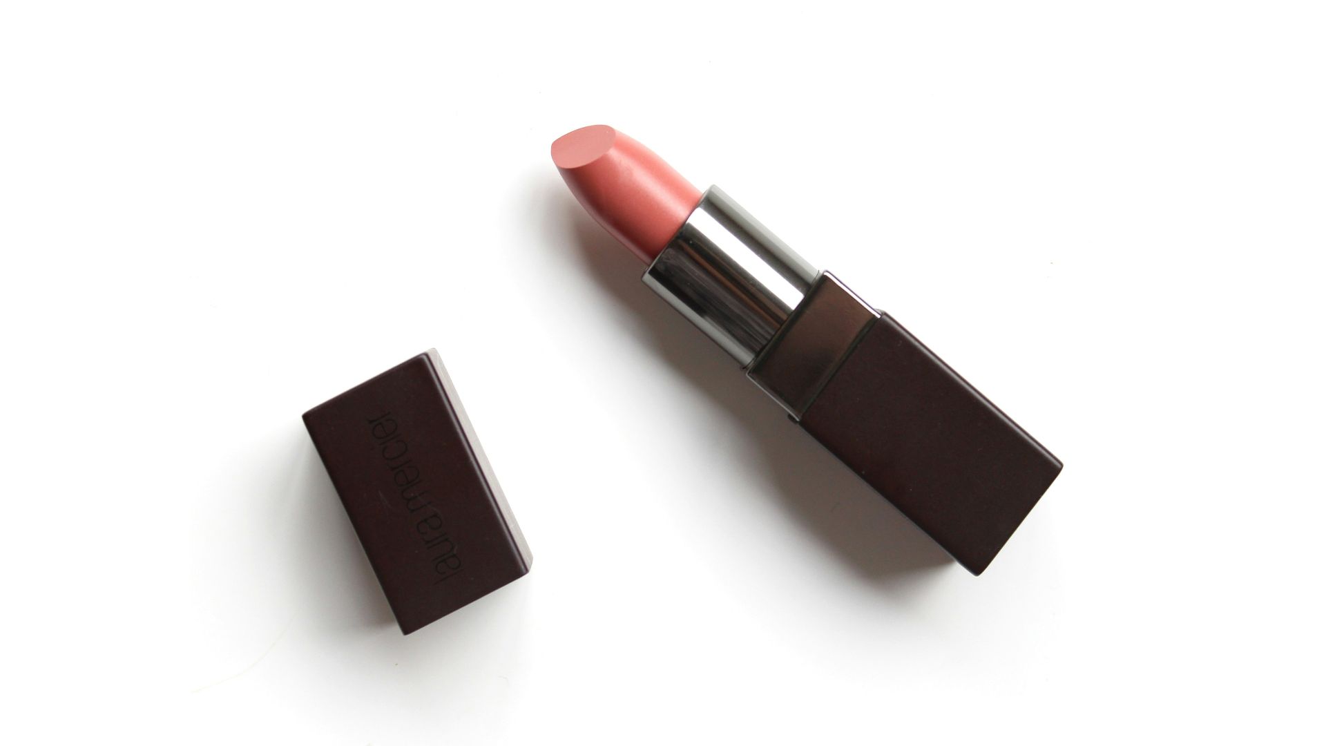 red lipstick on white surface