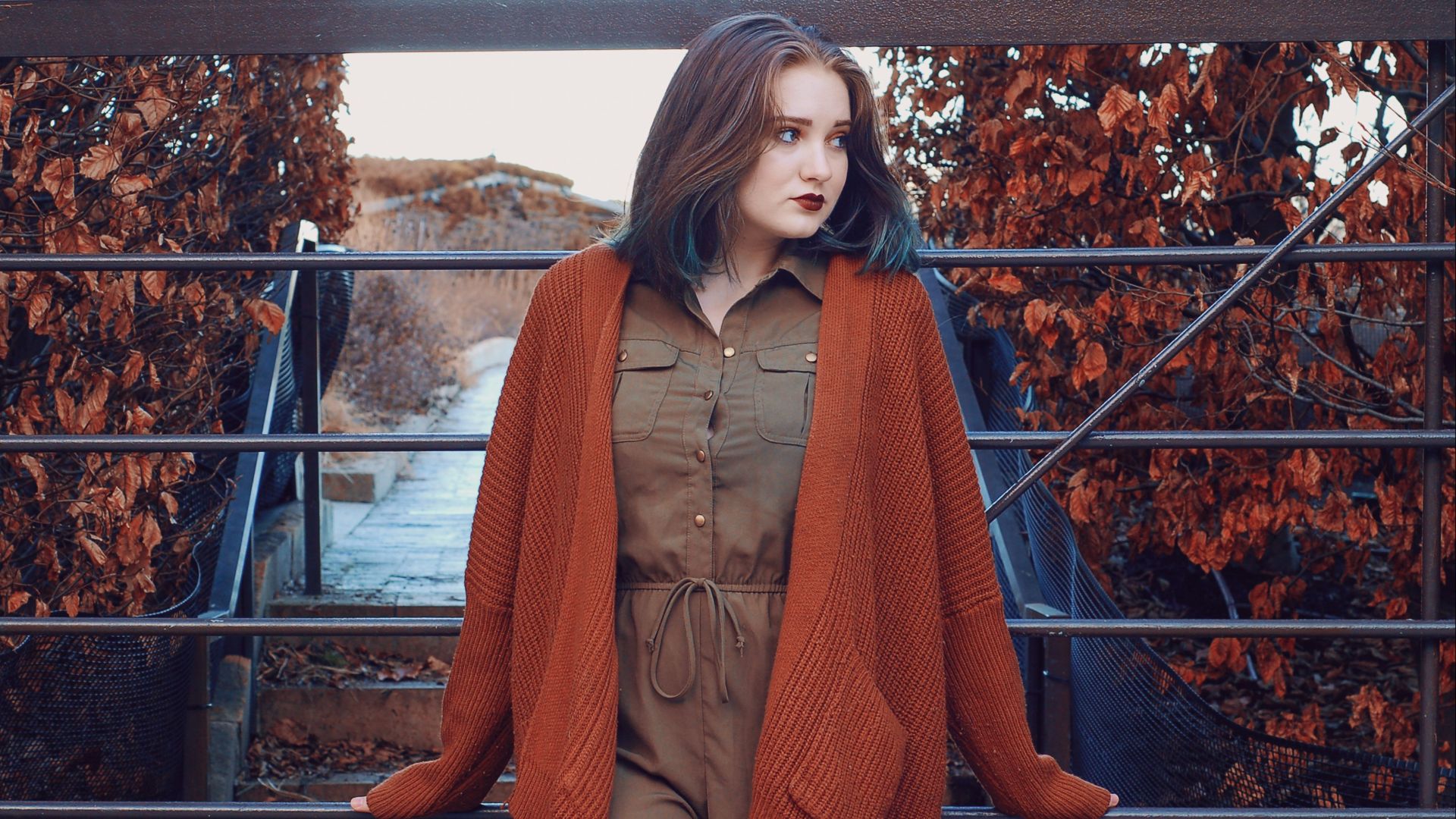 woman wearing brown button-up dress and orange open long-sleeved cardigan during daytime