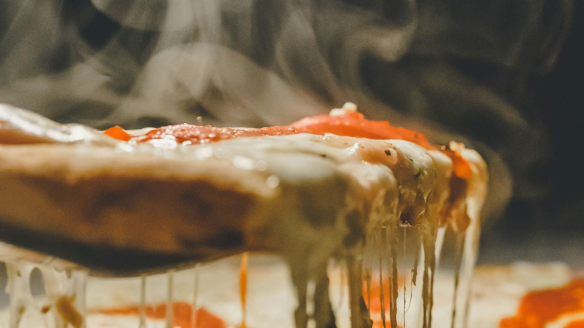 close up photo of pizza with cheese