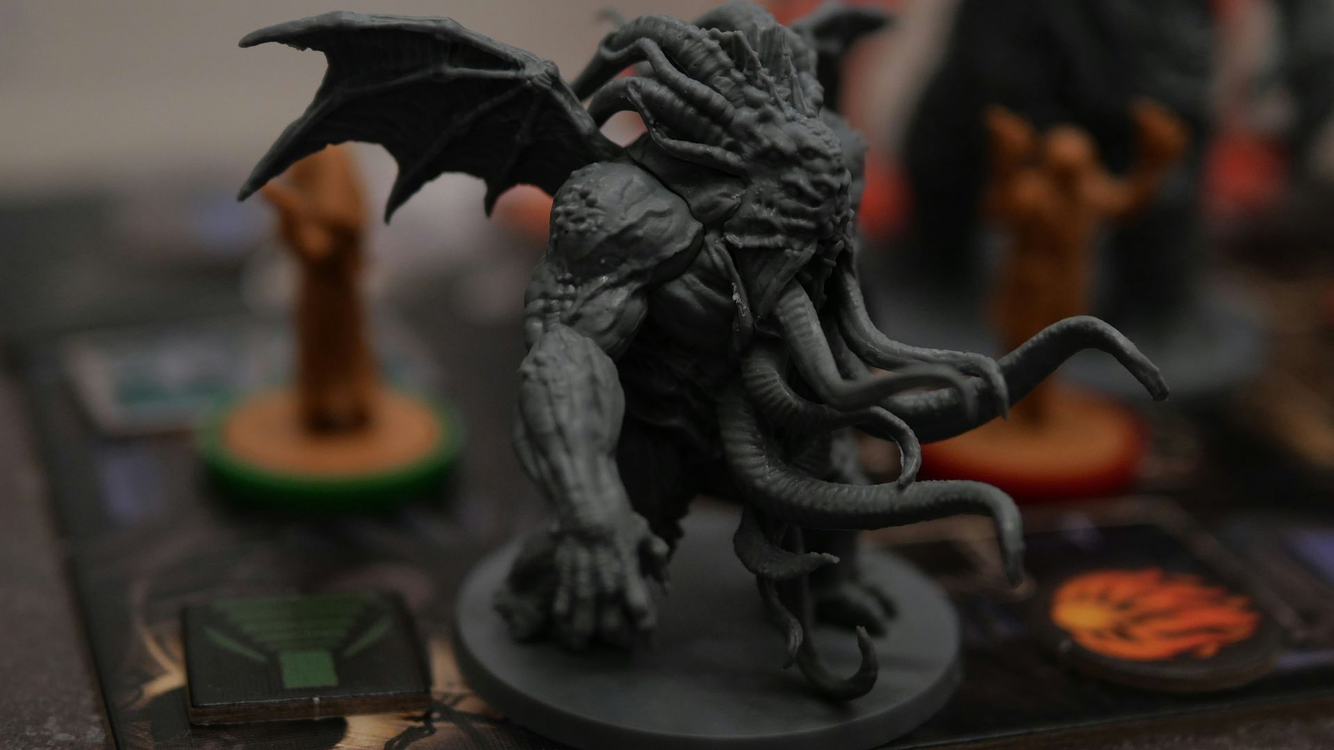 a close up of a dragon figurine on a board game