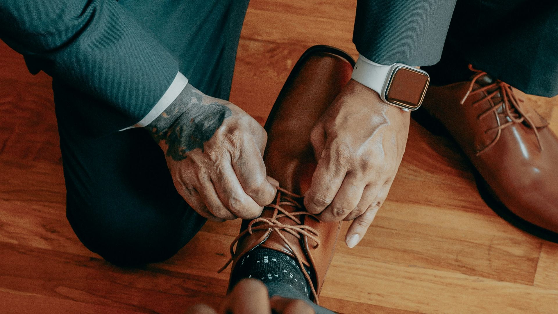 a group of people tying their shoes